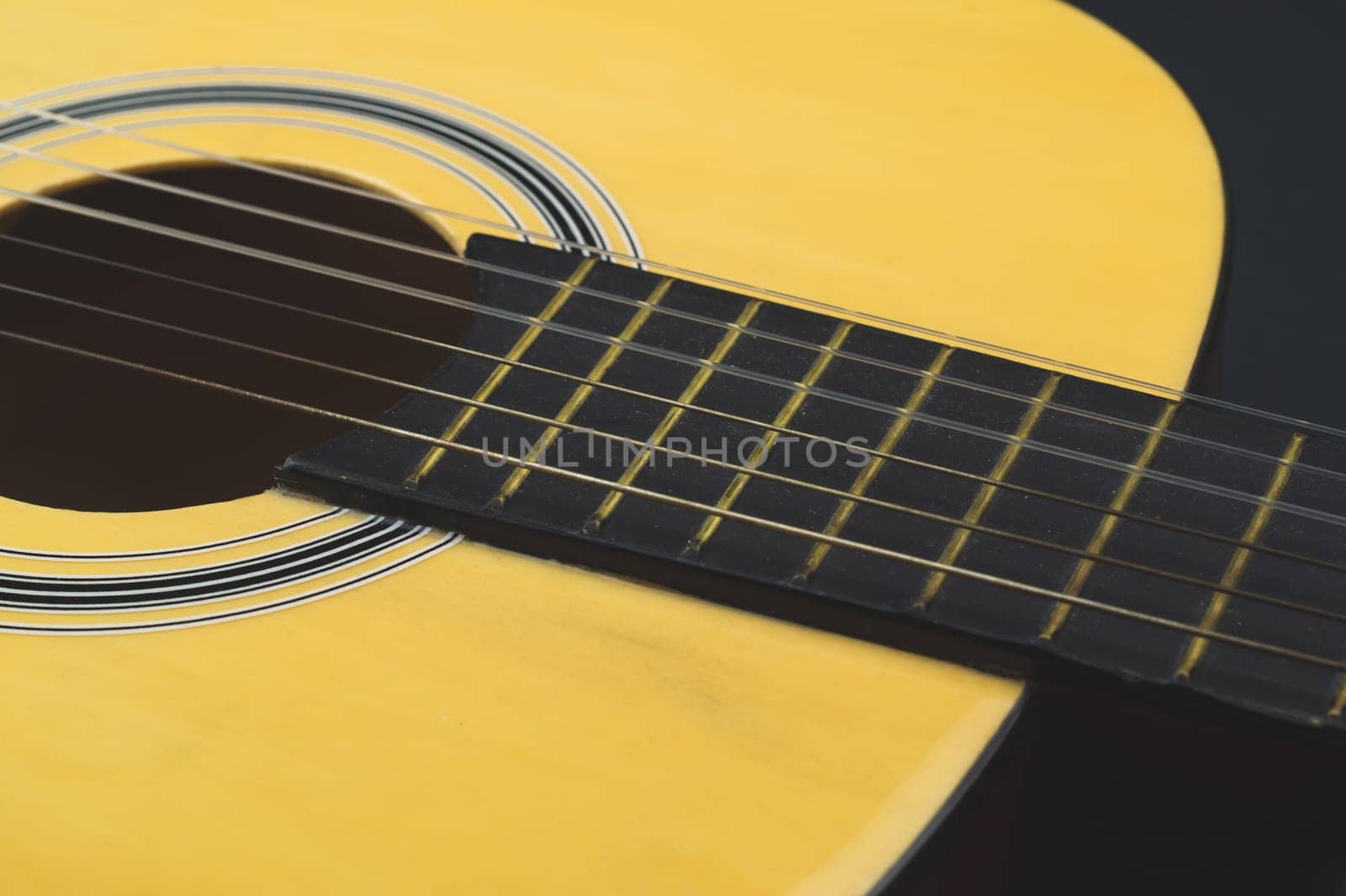 Guitar close up. acoustic musical instrument. strings on the guitar neck