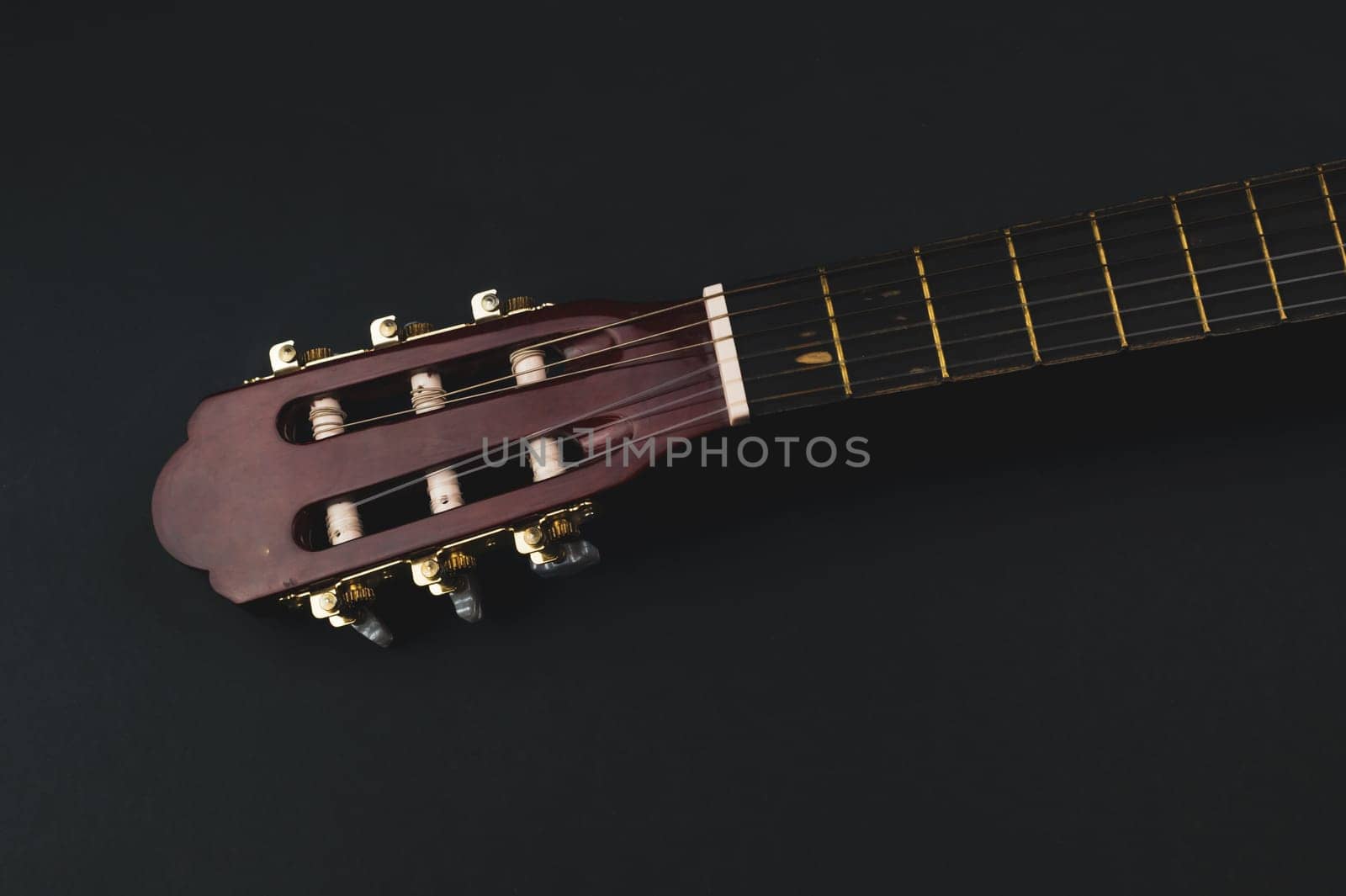 Guitar headstock close up. acoustic musical instrument. copy space