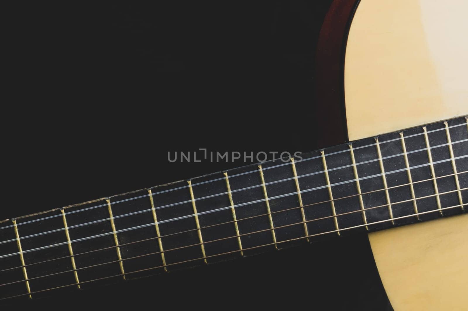 Guitar close up. acoustic musical instrument. strings on the guitar neck