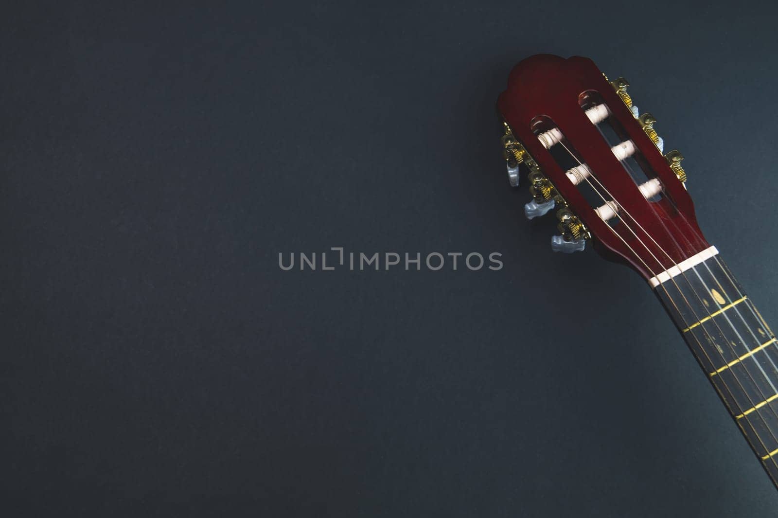 Guitar headstock close up. acoustic musical instrument. copy space