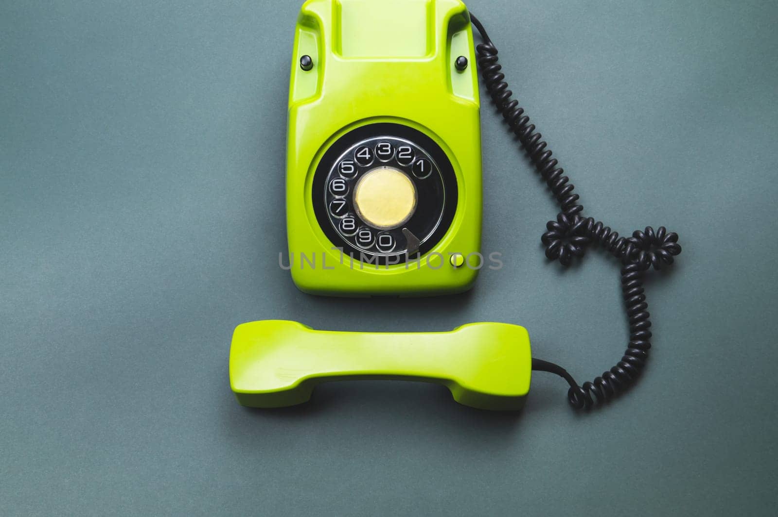 Classic phone with handset. vintage green telephone with phone receiver. office background. old communication technology. copy space