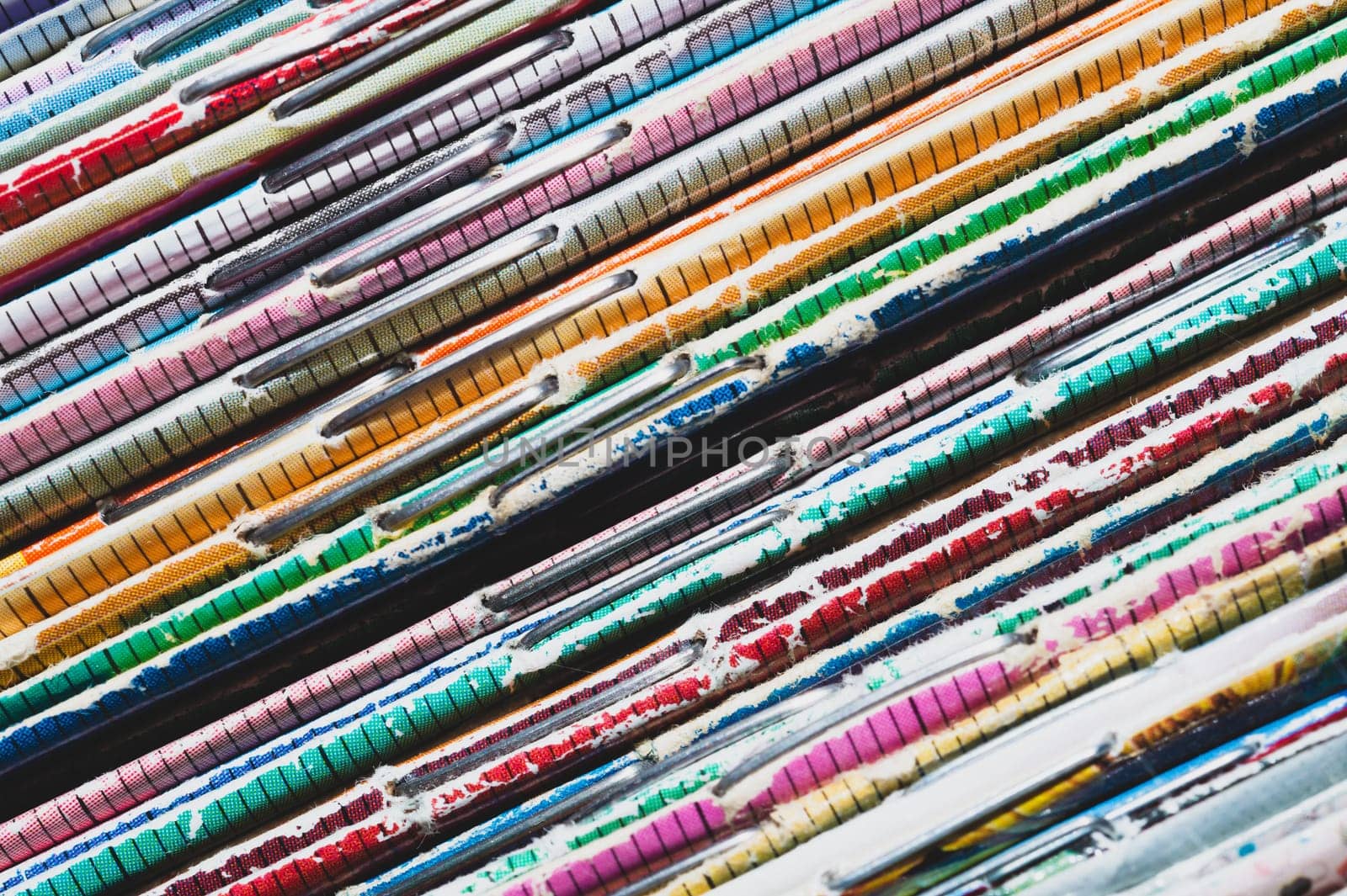 Stack of old magazines. pile of retro newspapers. vintage journals lie on top of each other. colorful background from the printed publications