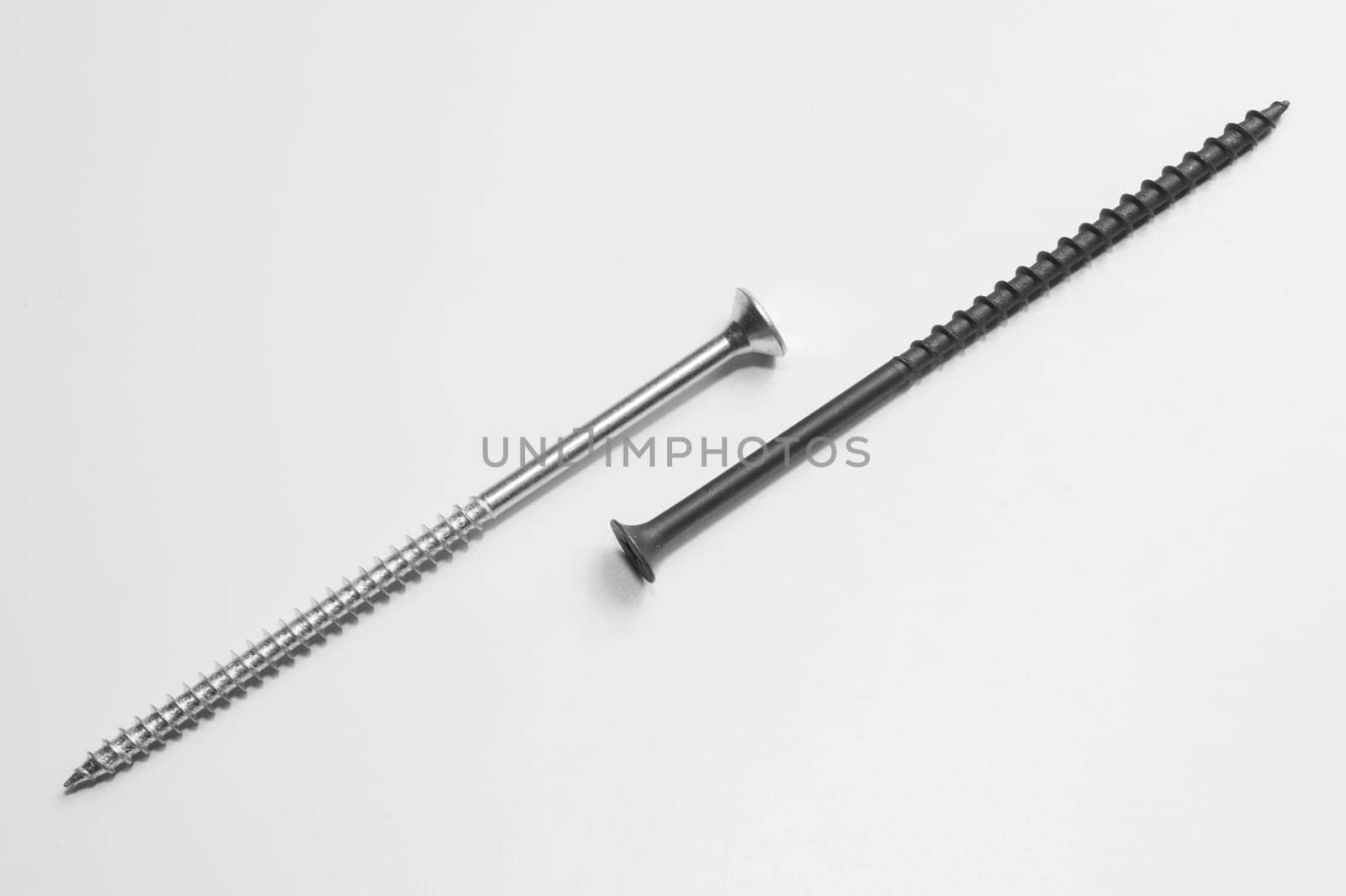 Steel screw on a white background. working tools