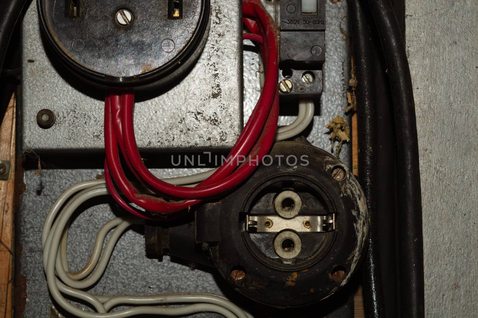 Old power socket in a electric power supply box. industrial background