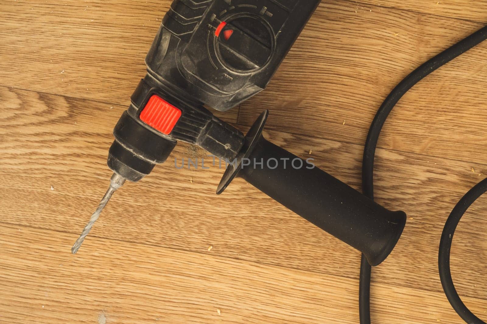 Electric drill on the floor. repair process. work tool
