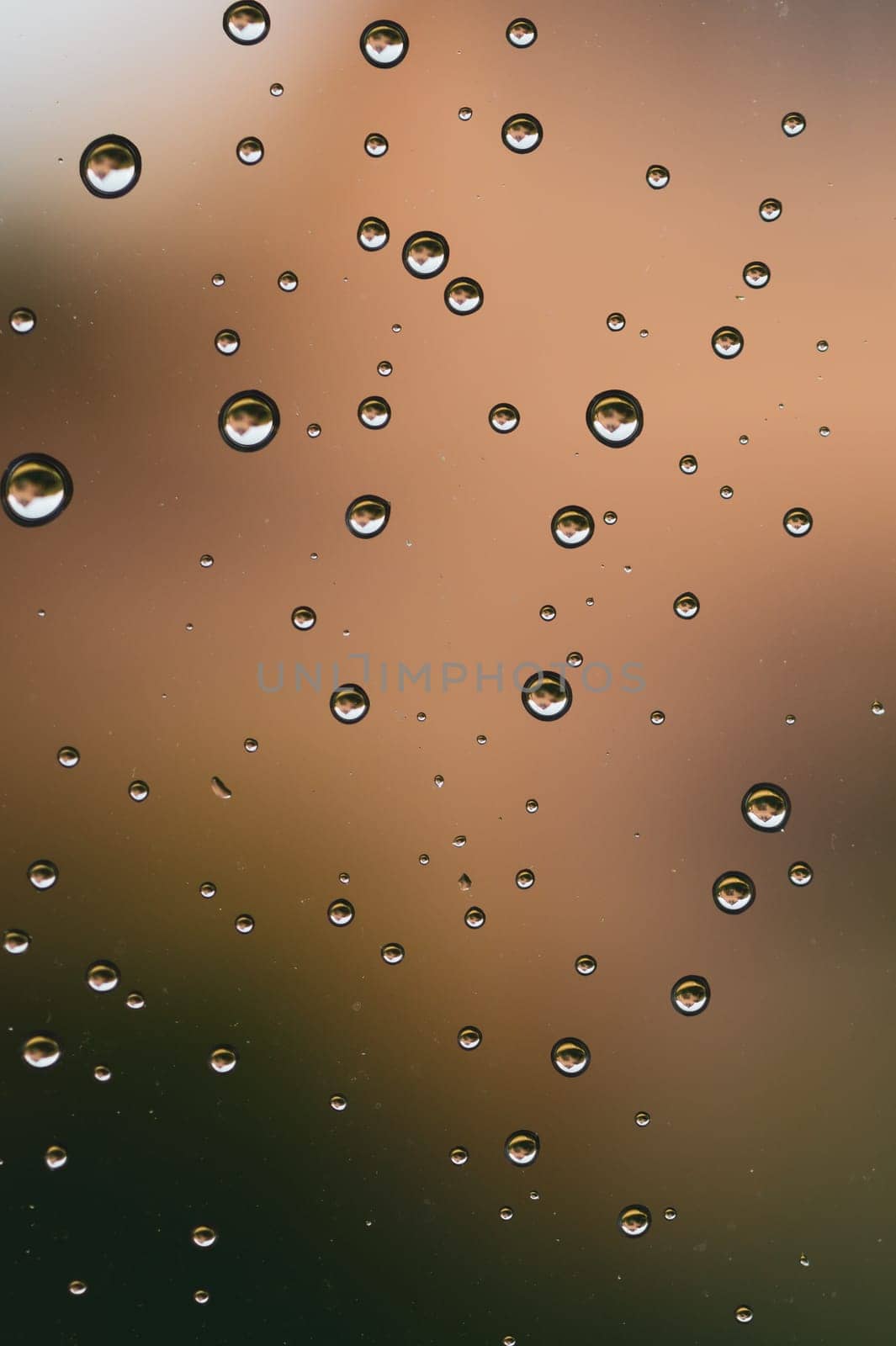 Raindrops on window glass close up. water drops macro background