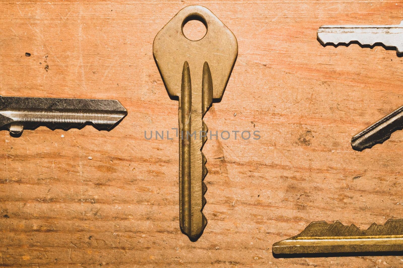 Different keys on wooden background. safety and security concept