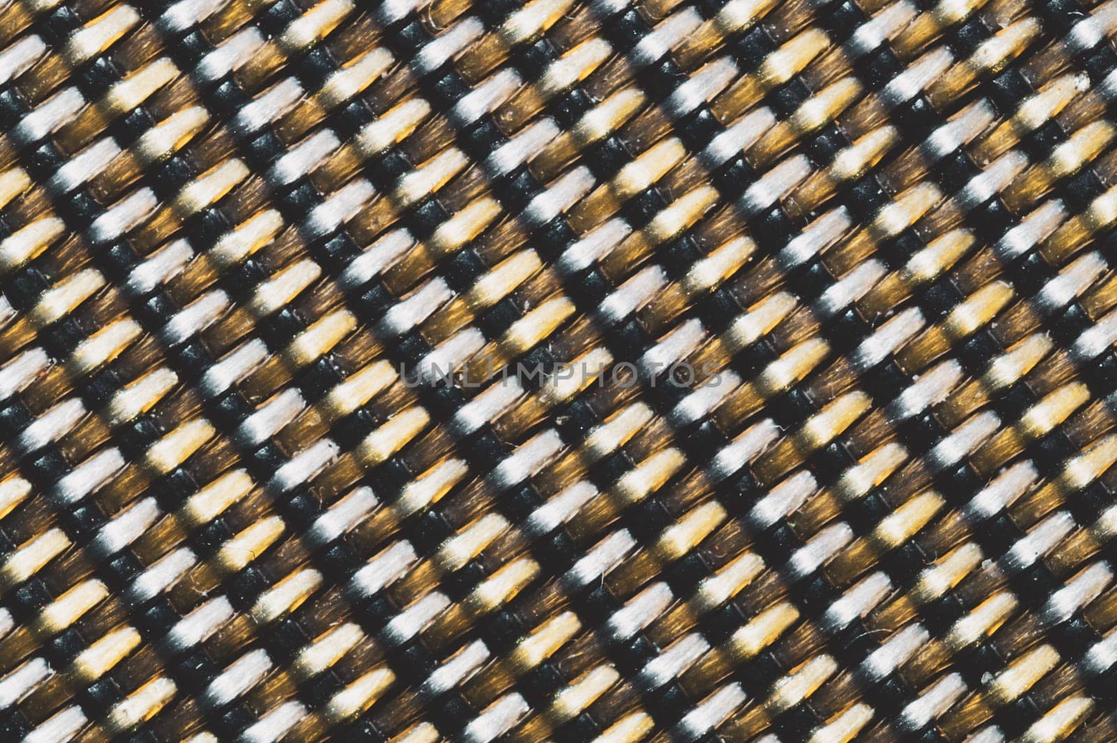 Woven pattern from threads macro. fabric texture. textile background extremely close up
