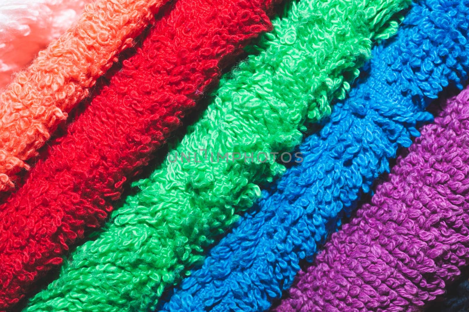 Different colorful towels close up
