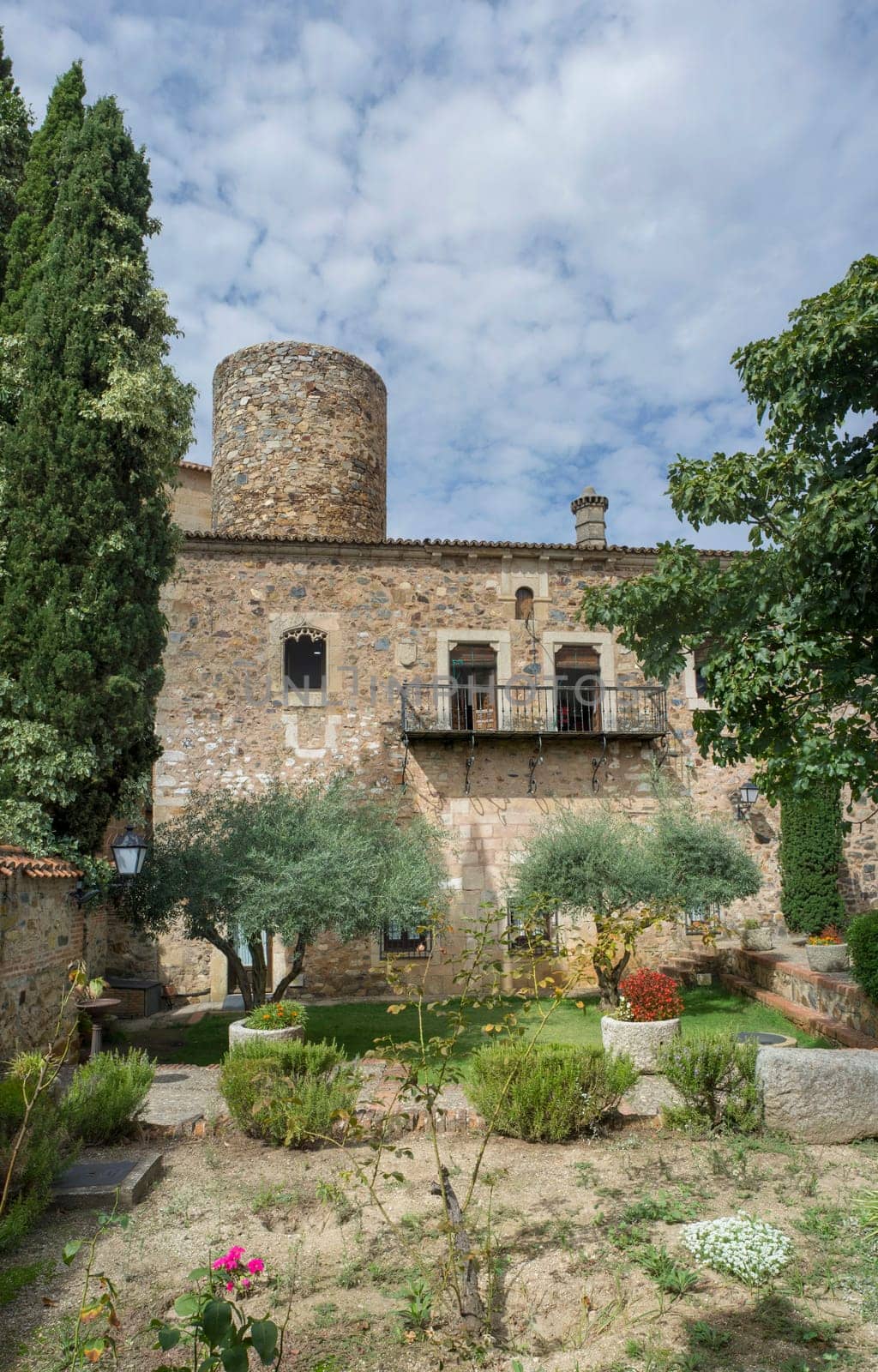 Caceres, Spain - Oct 1st, 2021: Palace of Carvajal garden. One of the most emblematic building of monumental Complex of Caceres, Extremadura, Spain