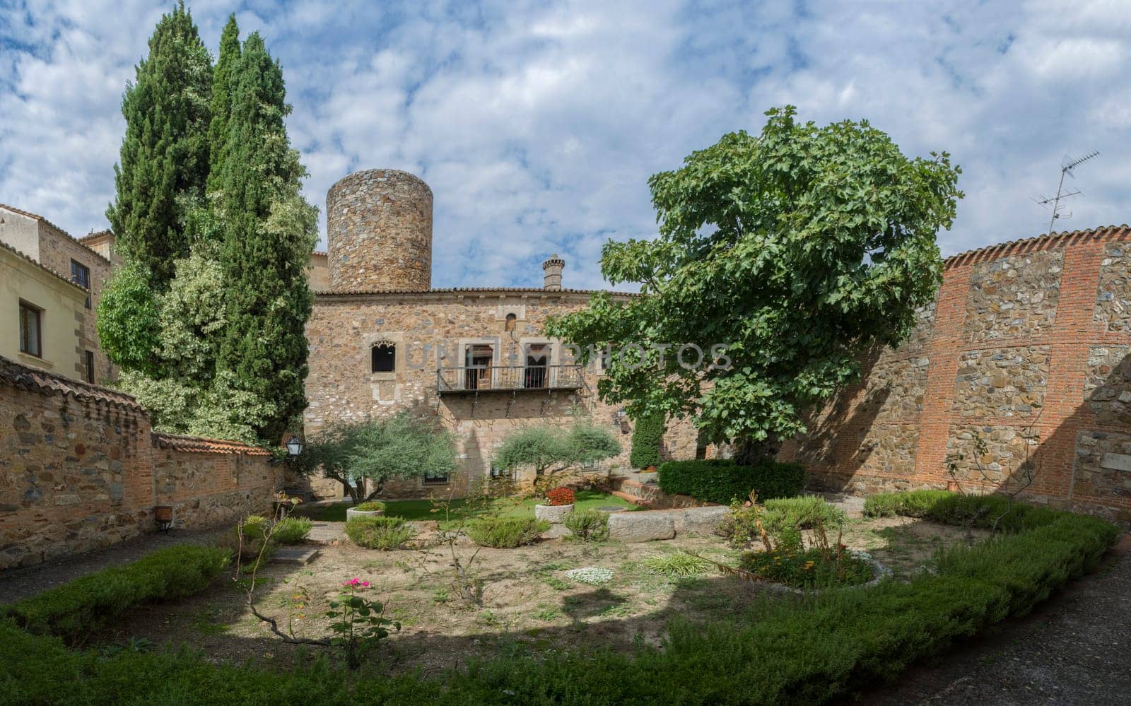 Caceres, Spain - Oct 1st, 2021: Palace of Carvajal garden. One of the most emblematic building of monumental Complex of Caceres, Extremadura, Spain