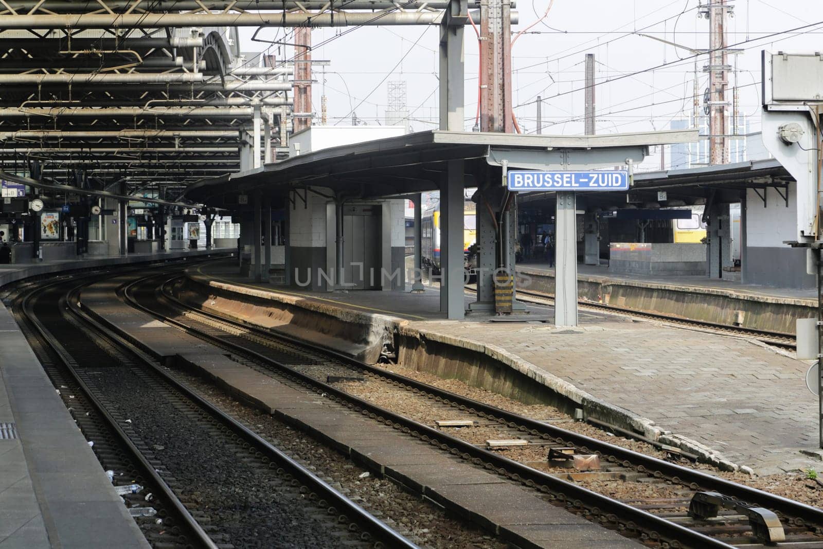Rail tracks and trains in the Brussels South Railway Station