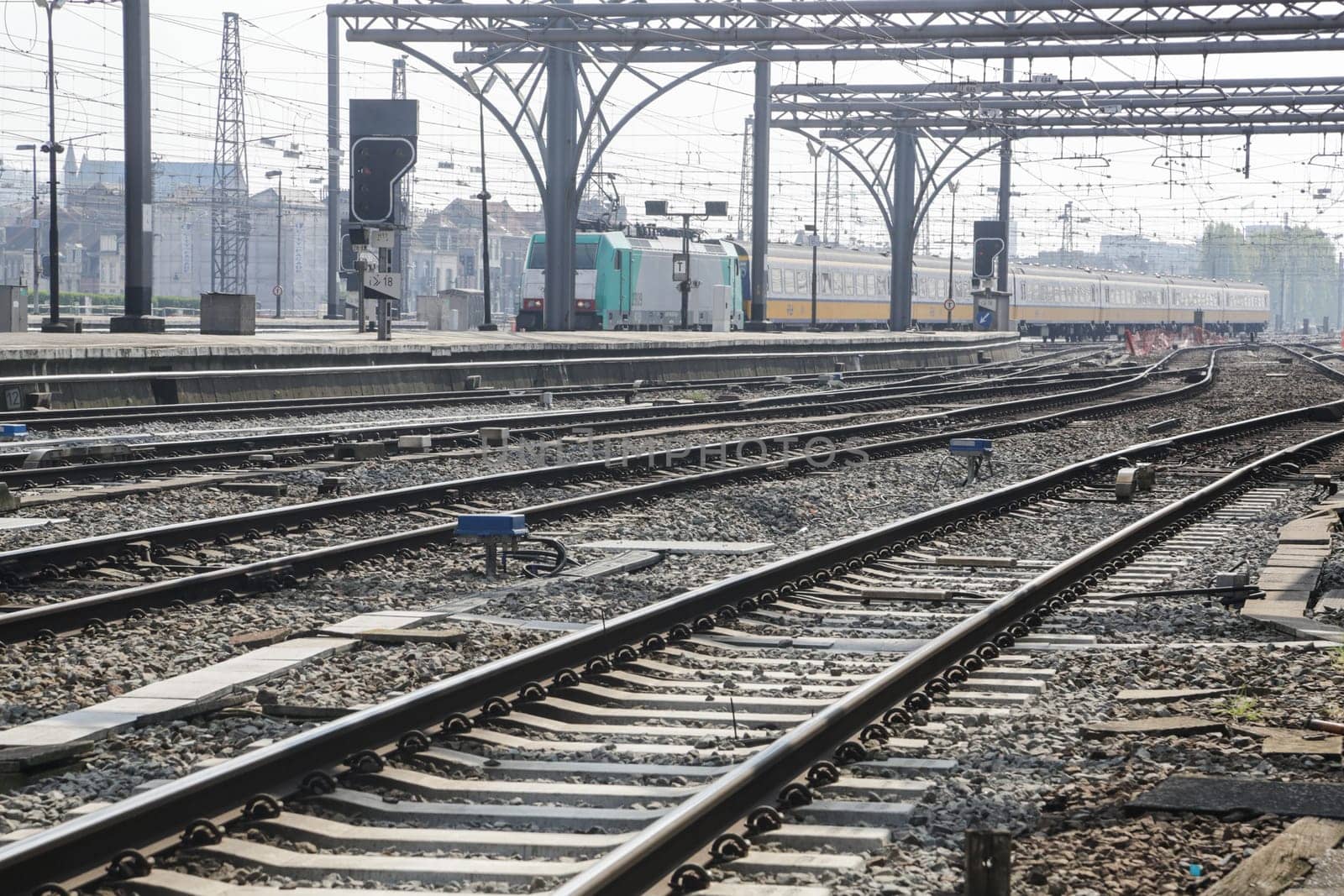 Rail tracks and trains in the Brussels South Railway Station