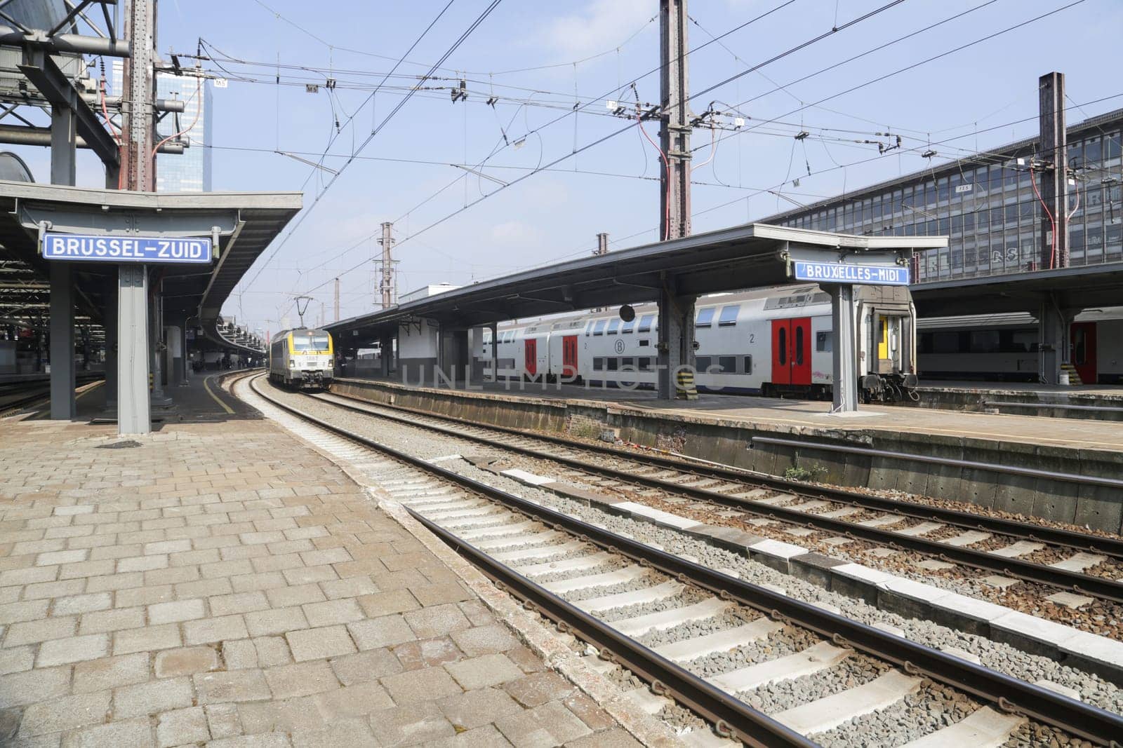 Rail tracks and trains in the Brussels South Railway Station