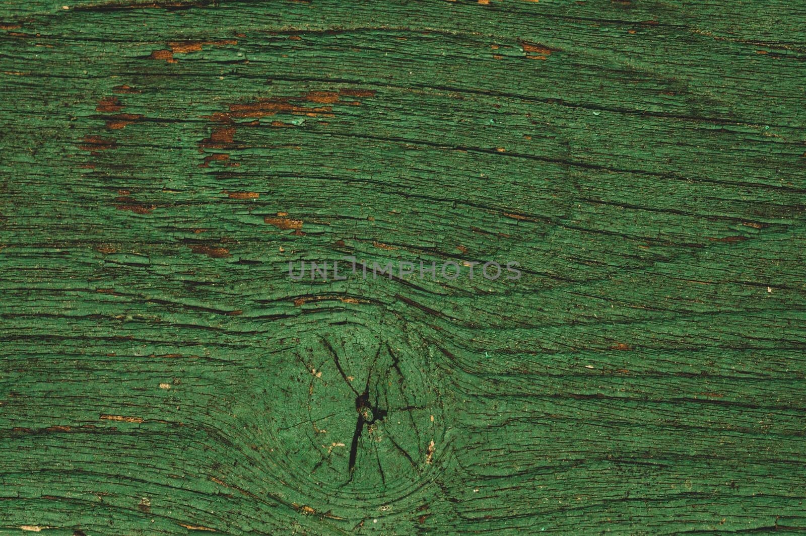 Abstract wood texture with peeling paint. green wooden backdrop. shabby painted wood background