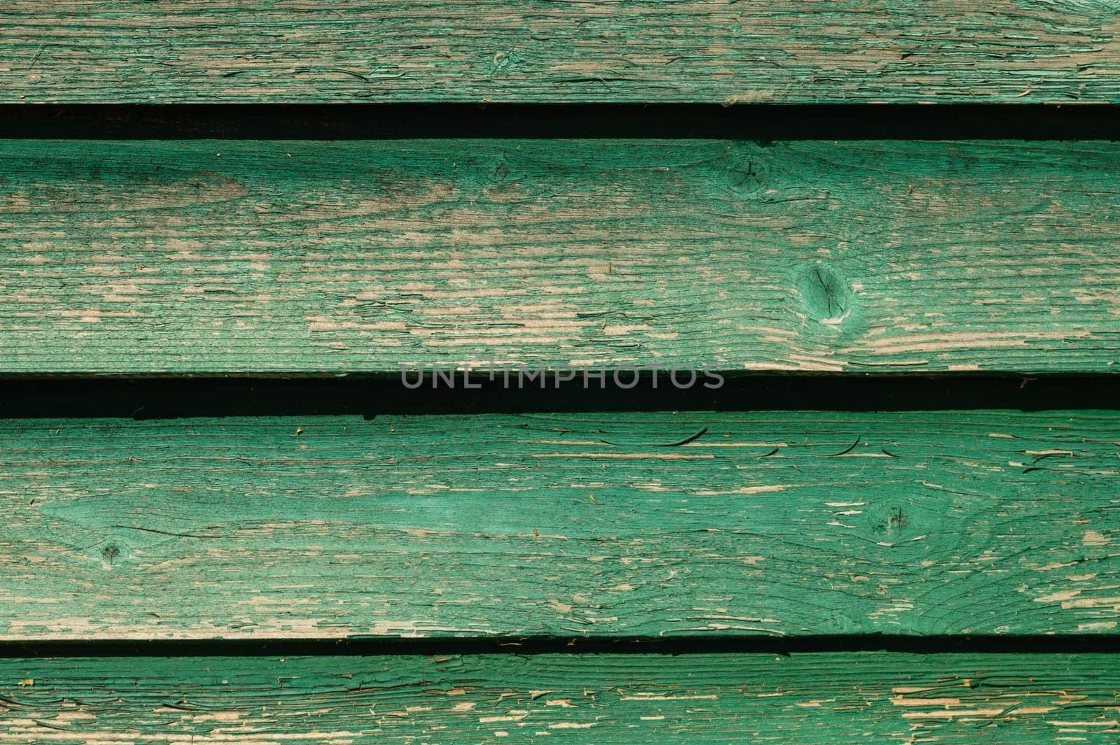 Colored wood texture. green wooden planks. shabby painted wood background