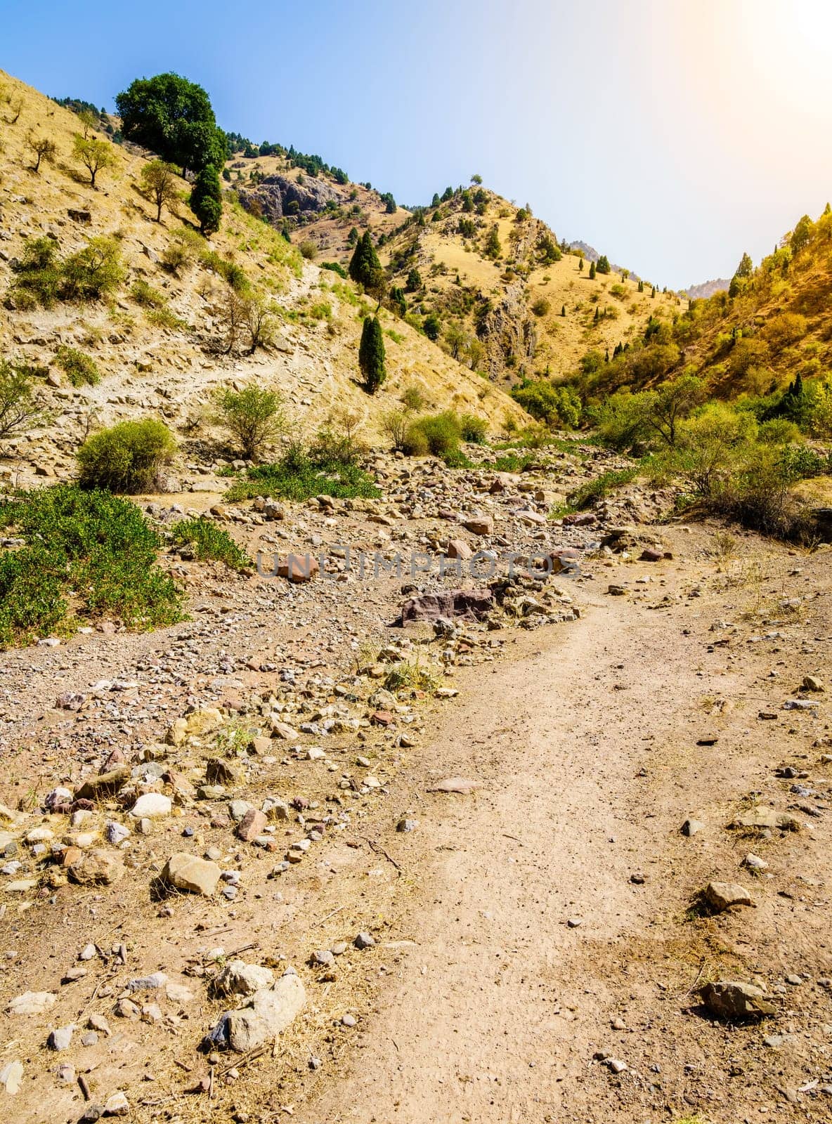 Dry river bed and a trail in Hissar Valley in Tajikistan