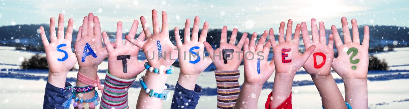 Children Hands Building Colorful English Word Satisfied. Snowy Winter Background With Snowflakes