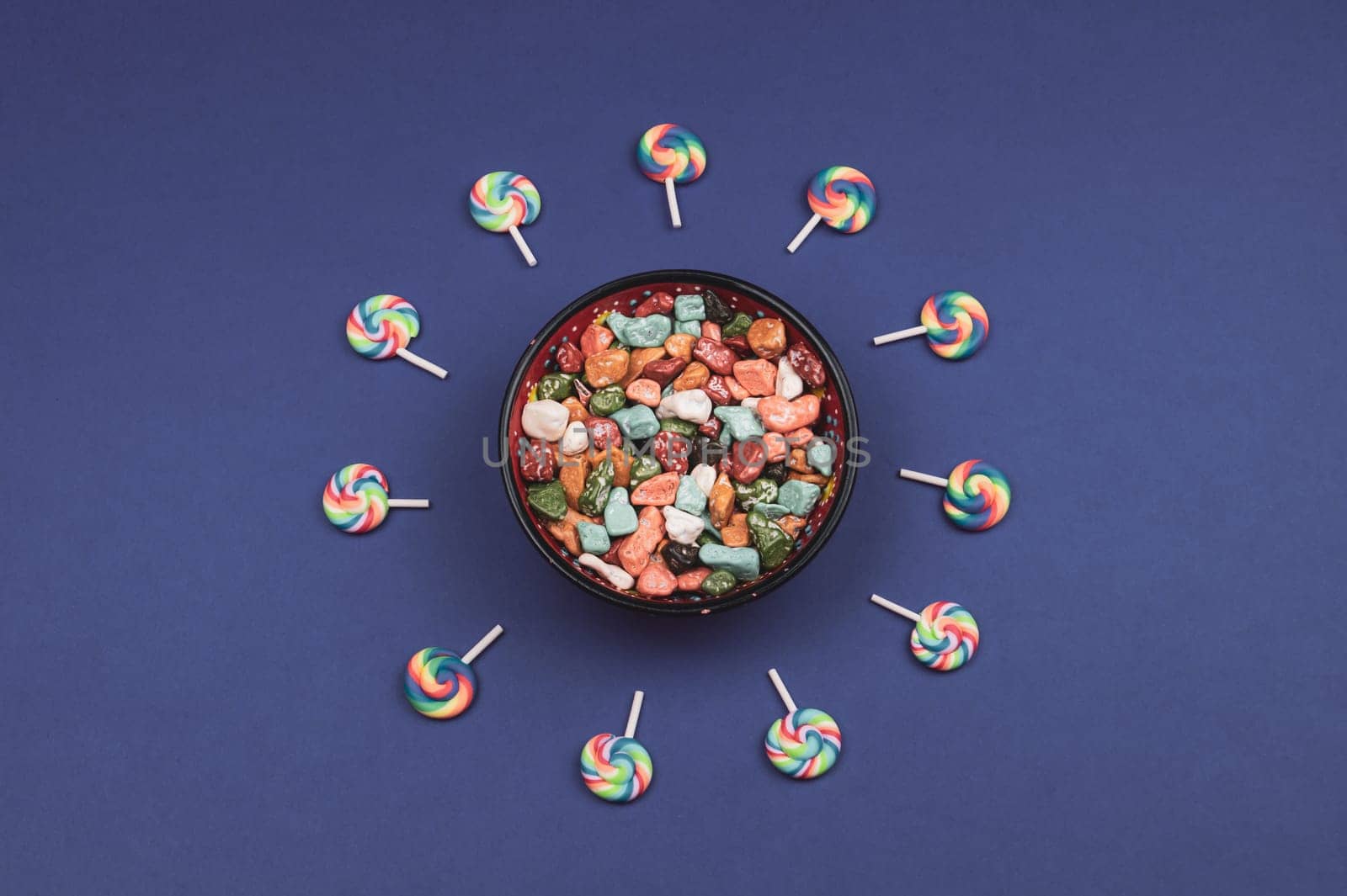 Lollipops and candies. candy bowl with sweets in the form of colored stones. copy space