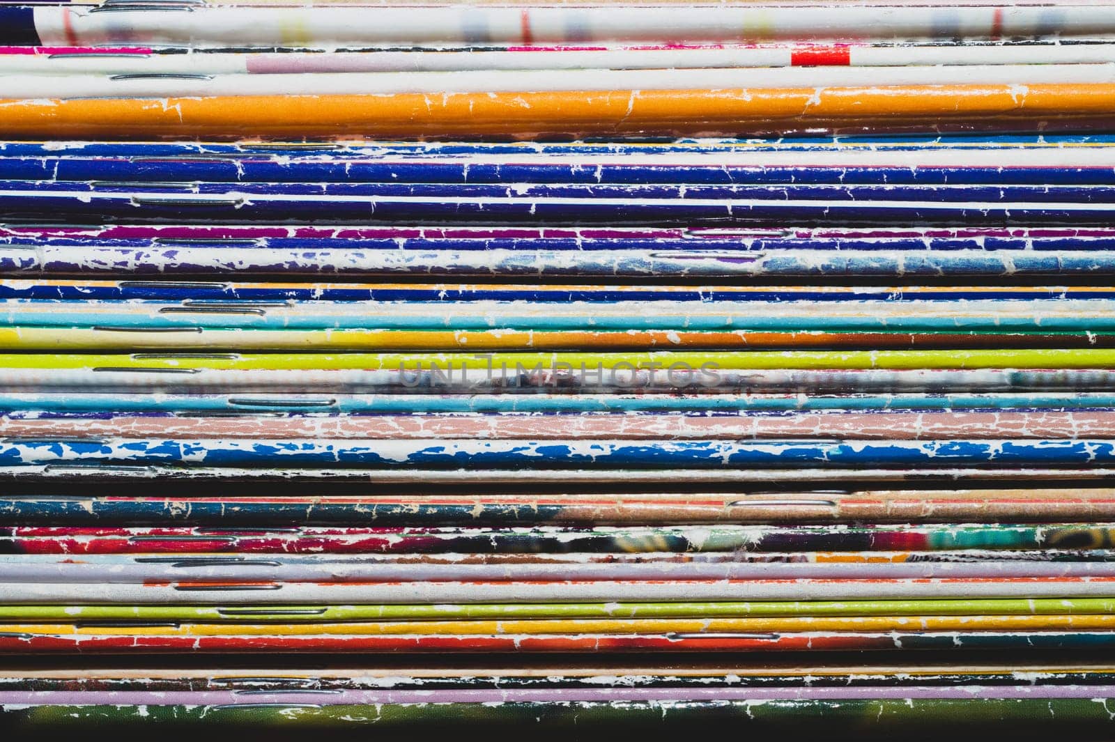 Stack of old magazines. pile of retro newspapers. vintage journals lie on top of each other. colorful background from the printed publications