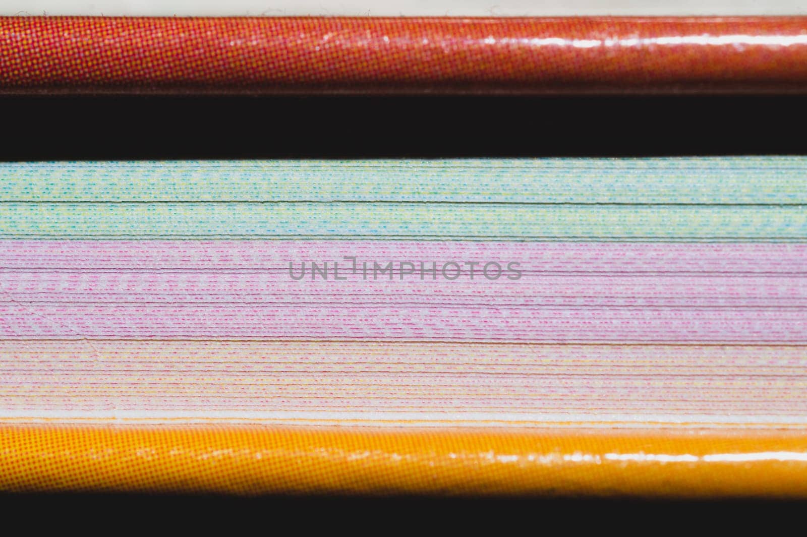 Colorful book pages close up. book edge macro