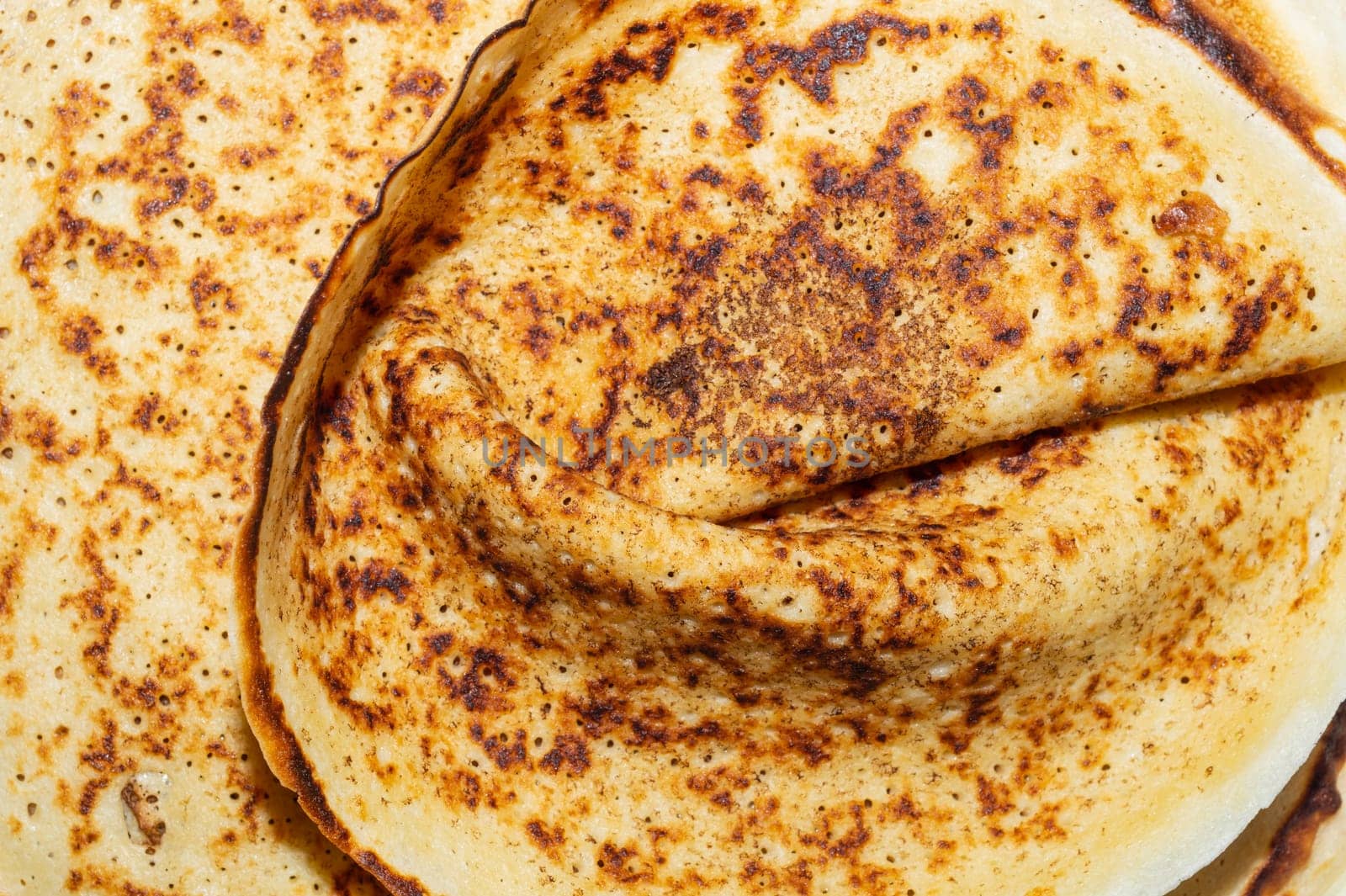 Thin pancakes close up background