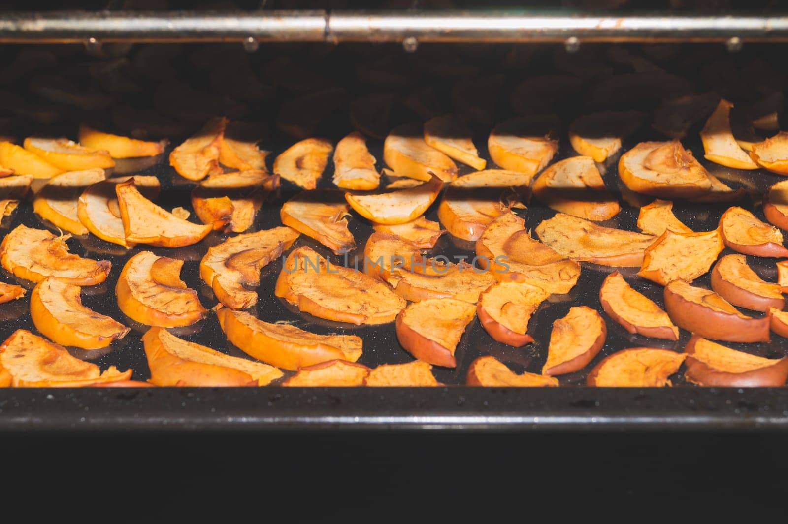 Dried apple slices in the oven. organic healthy food. vegetarian nutrition