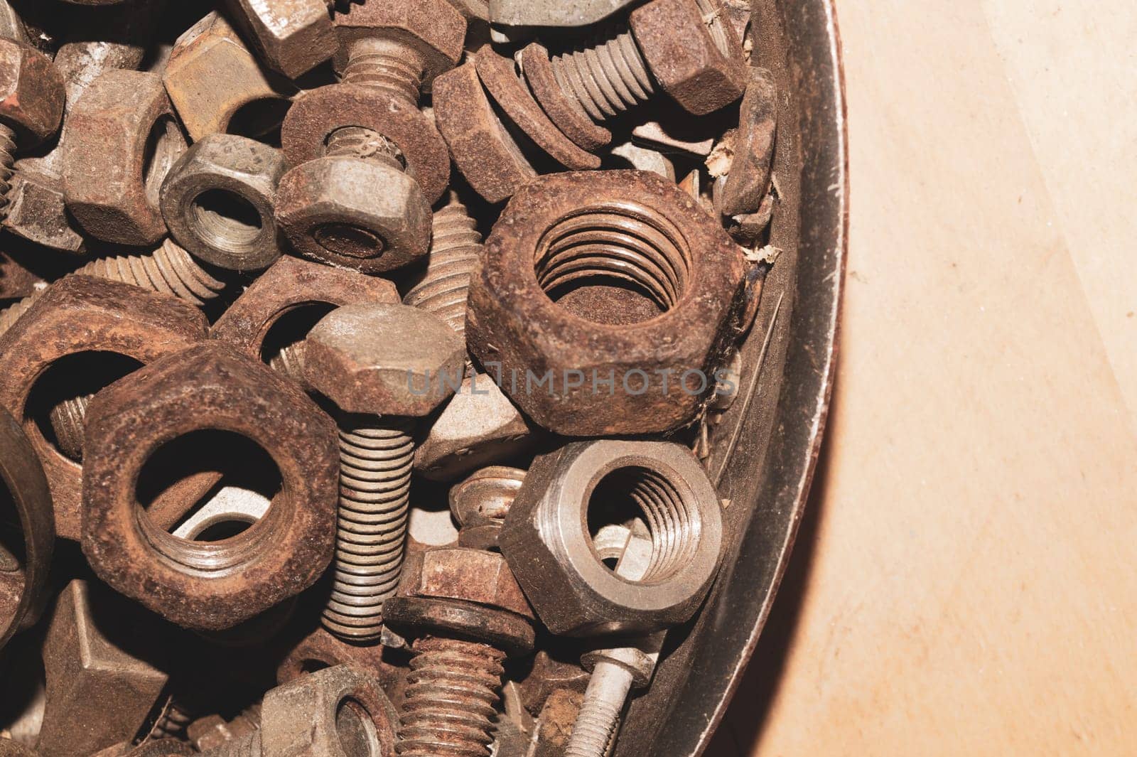 Old screws in a box. a lot of various screws. pile of fasteners in the box close up. carpentry workshop. work tool
