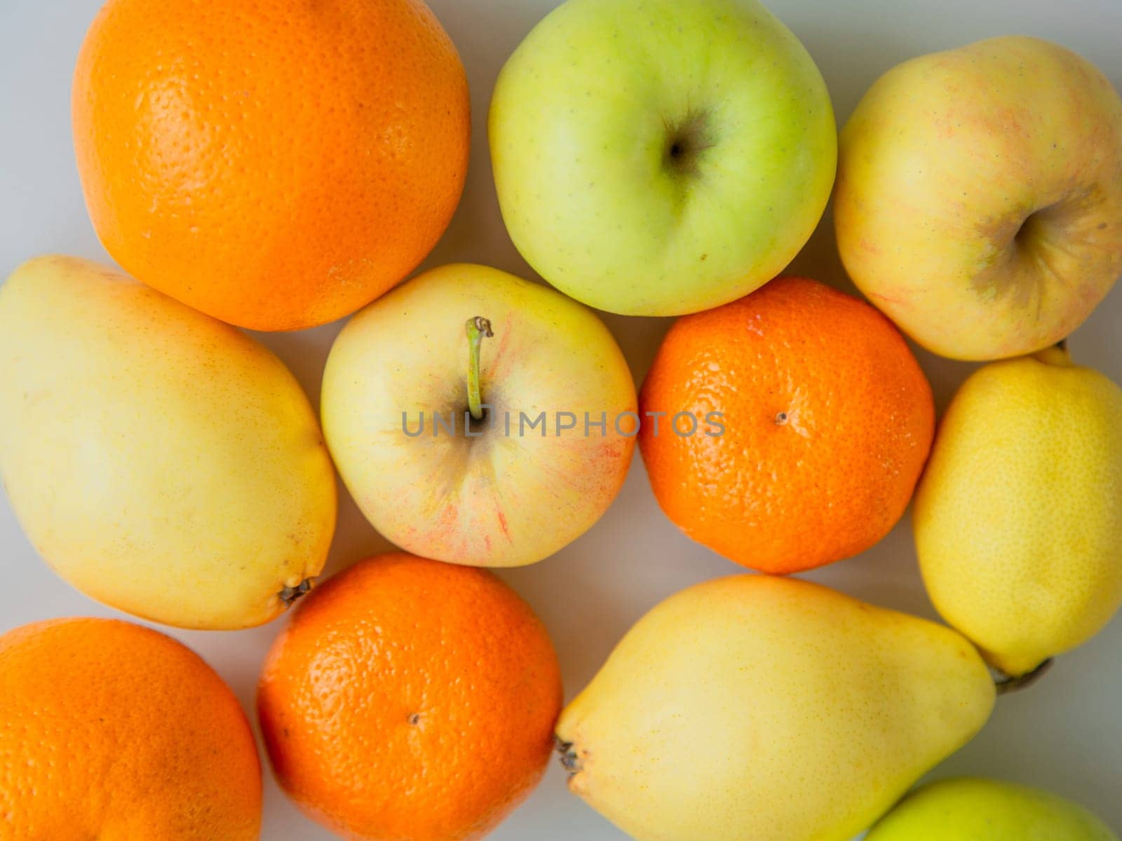 Fruits lie on a white background. High quality photo