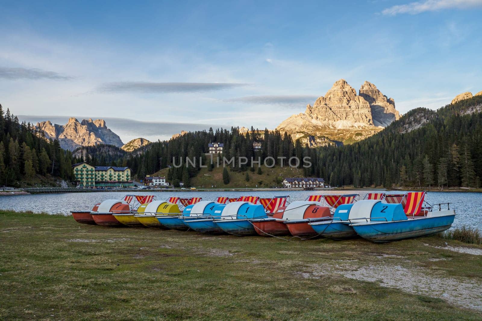 Lake Misurina or Lago di Misurina with pedal boats. View on the majestic Dolomites Alp Mountains, Tre Cime di Lavaredo peaks, South Tyrol, Italy