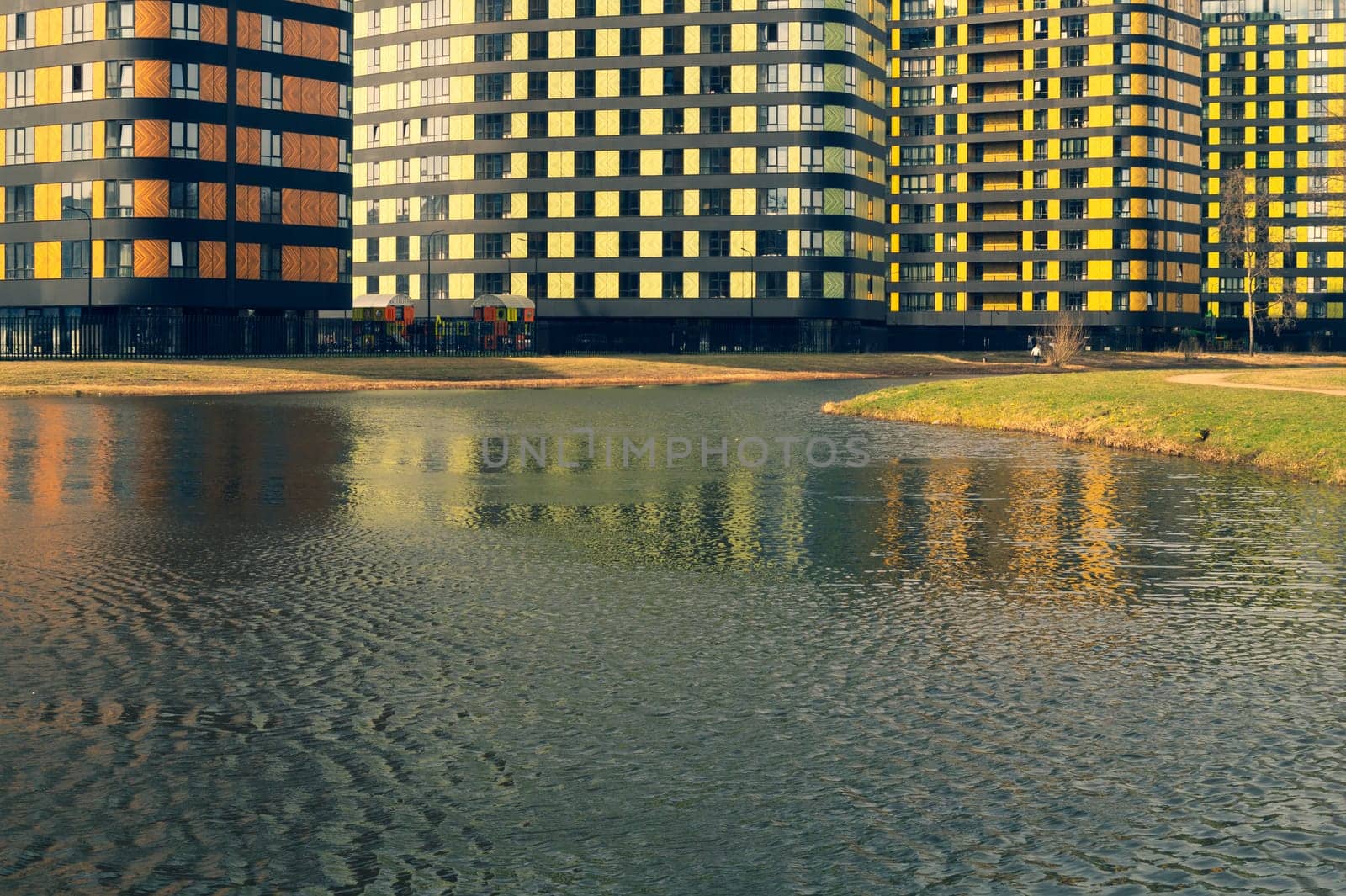 Modern buildings with lake and park. new constructed colorful building. modern residential construction