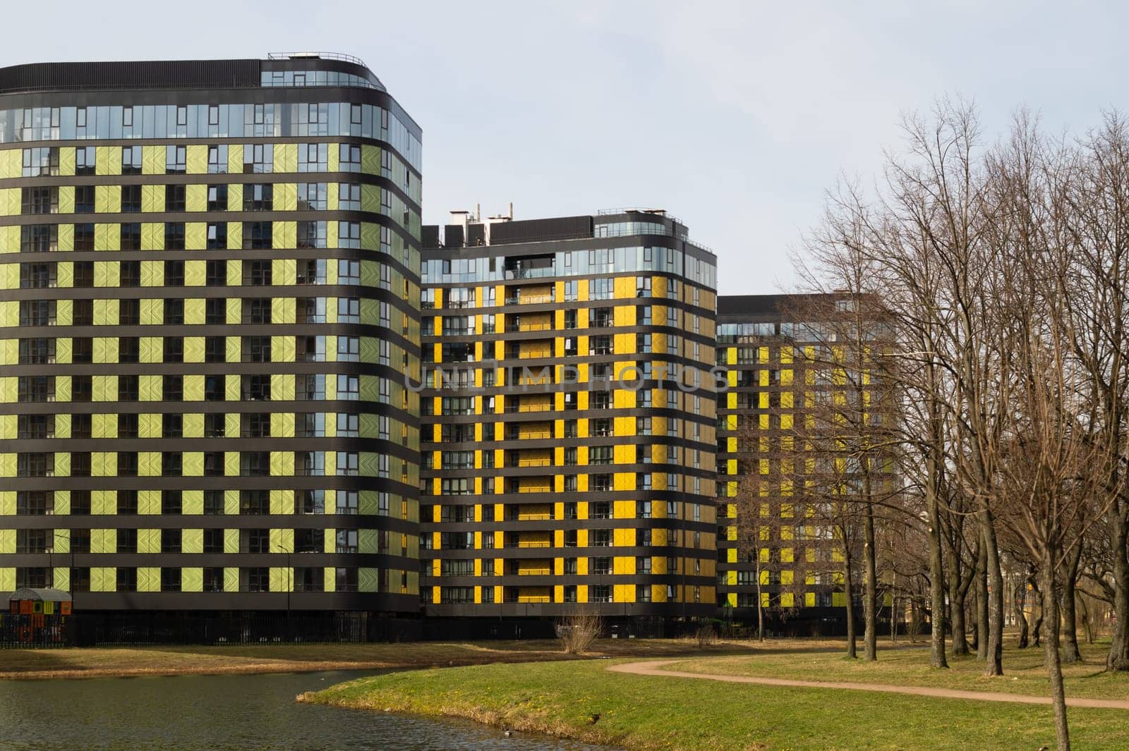 Modern buildings with lake and park. new constructed colorful building. modern residential construction