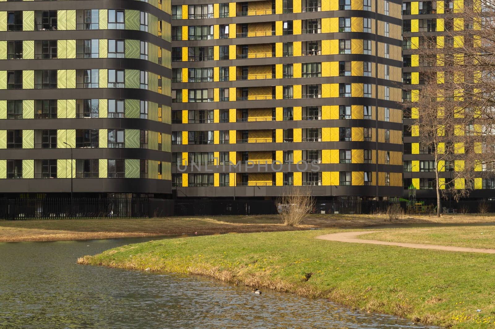 Modern buildings with lake and park. new constructed colorful building. modern residential construction