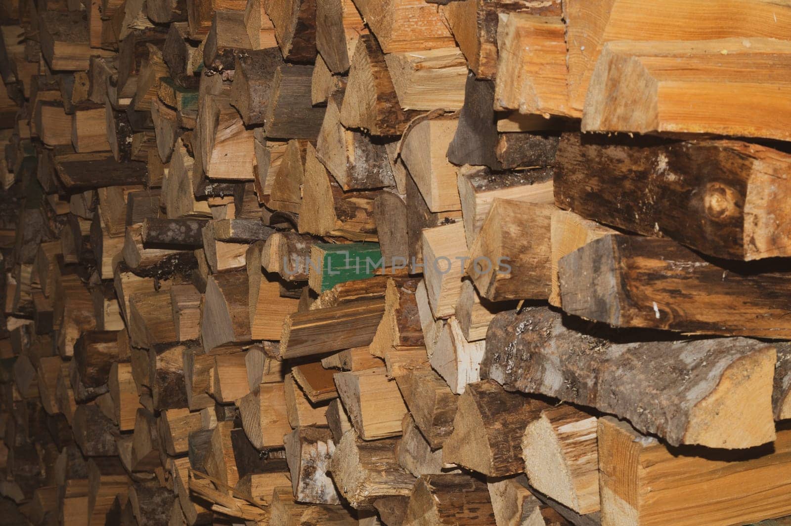 Stacks of firewood. preparation of firewood for the winter. pile of firewood