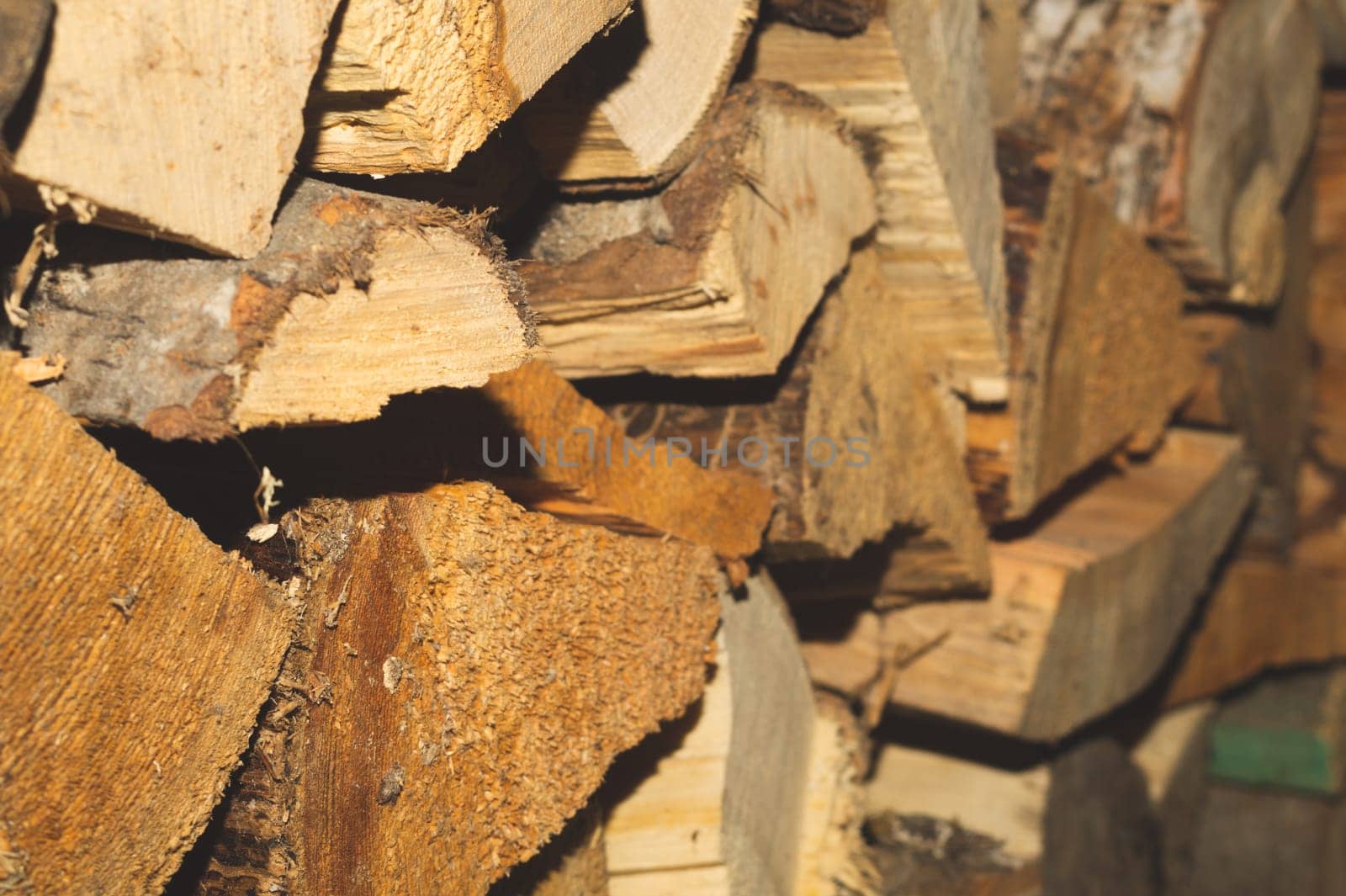 Stacks of firewood. preparation of firewood for the winter. pile of firewood
