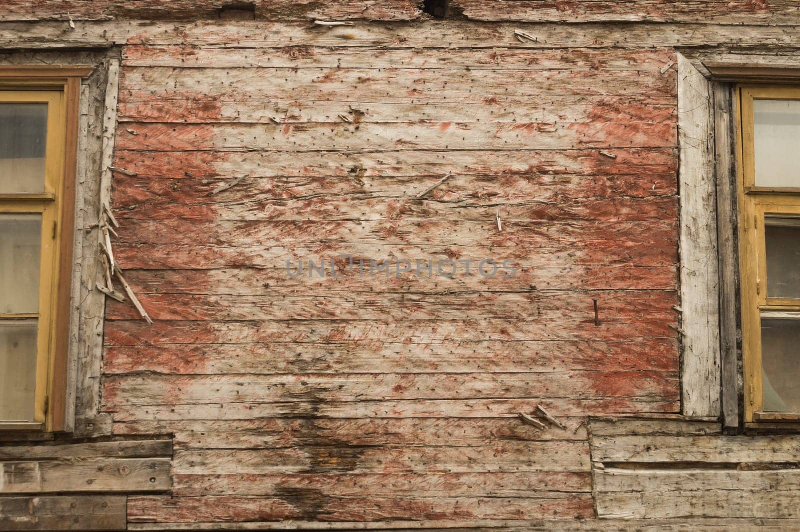 Windows of the old wooden house. wooden plank wall with windows background. copy dpace