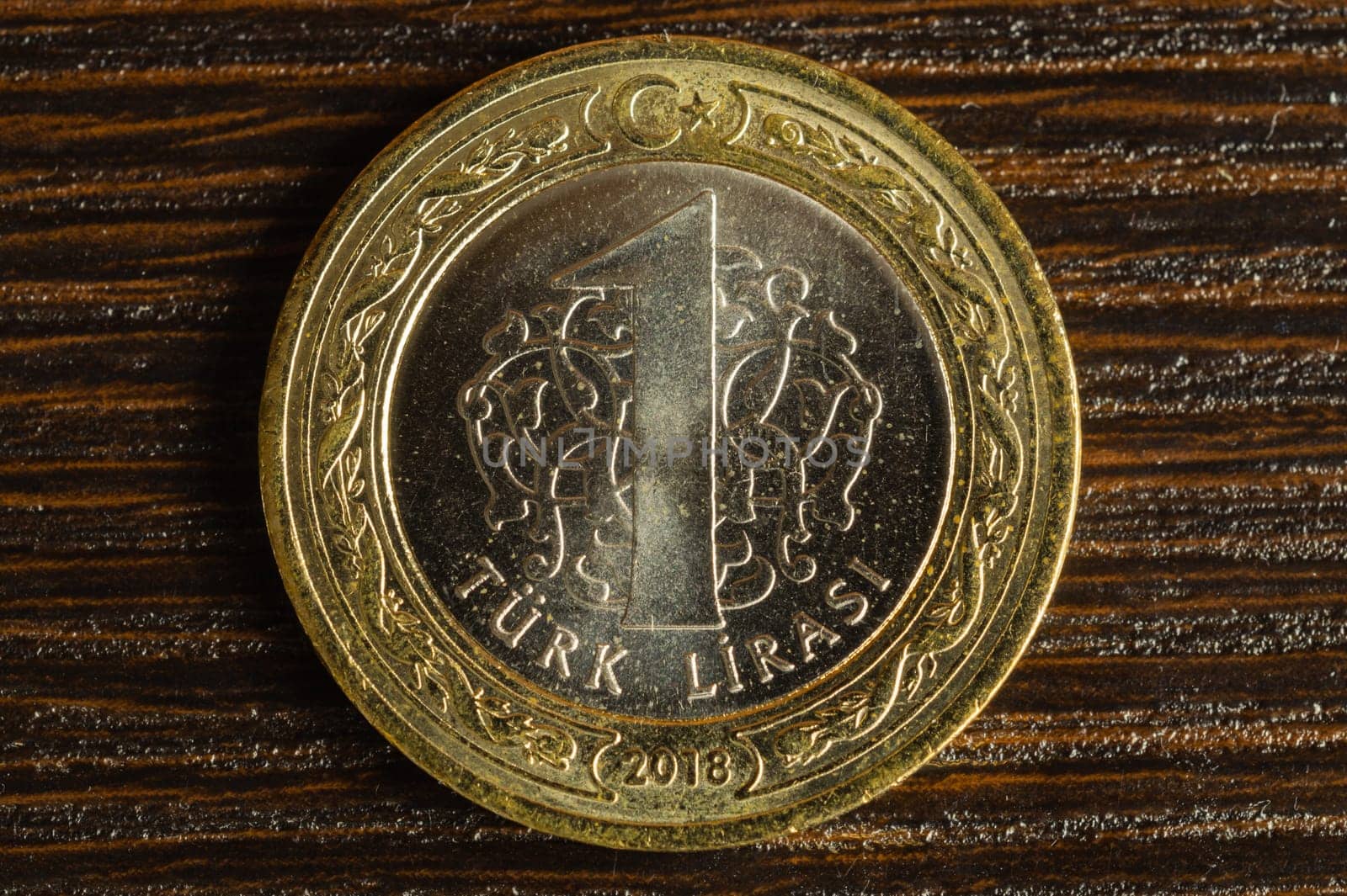 Turkish coin on a dark wooden background. lira from Turkey close up