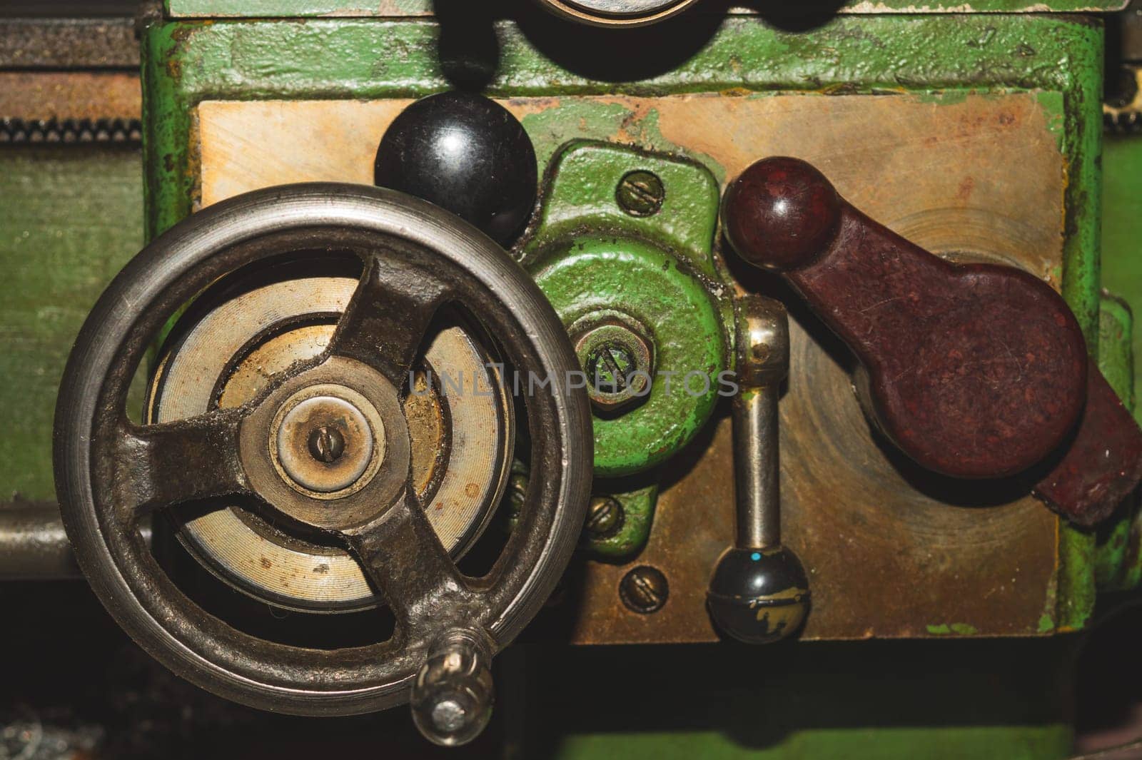 Old lathe. detail of rusty machine. metal mechanism. vintage metalworking machine close up. abstract industrial background