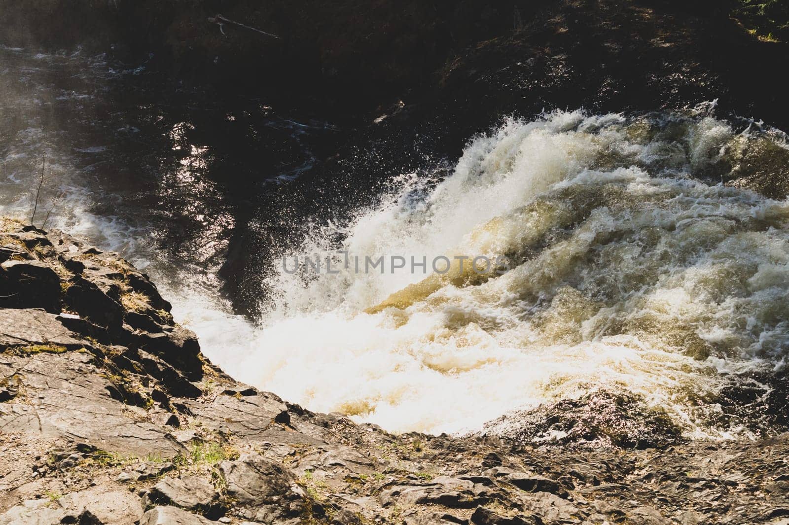 Waterfall nature background. rushing stream water. rocky flowing river