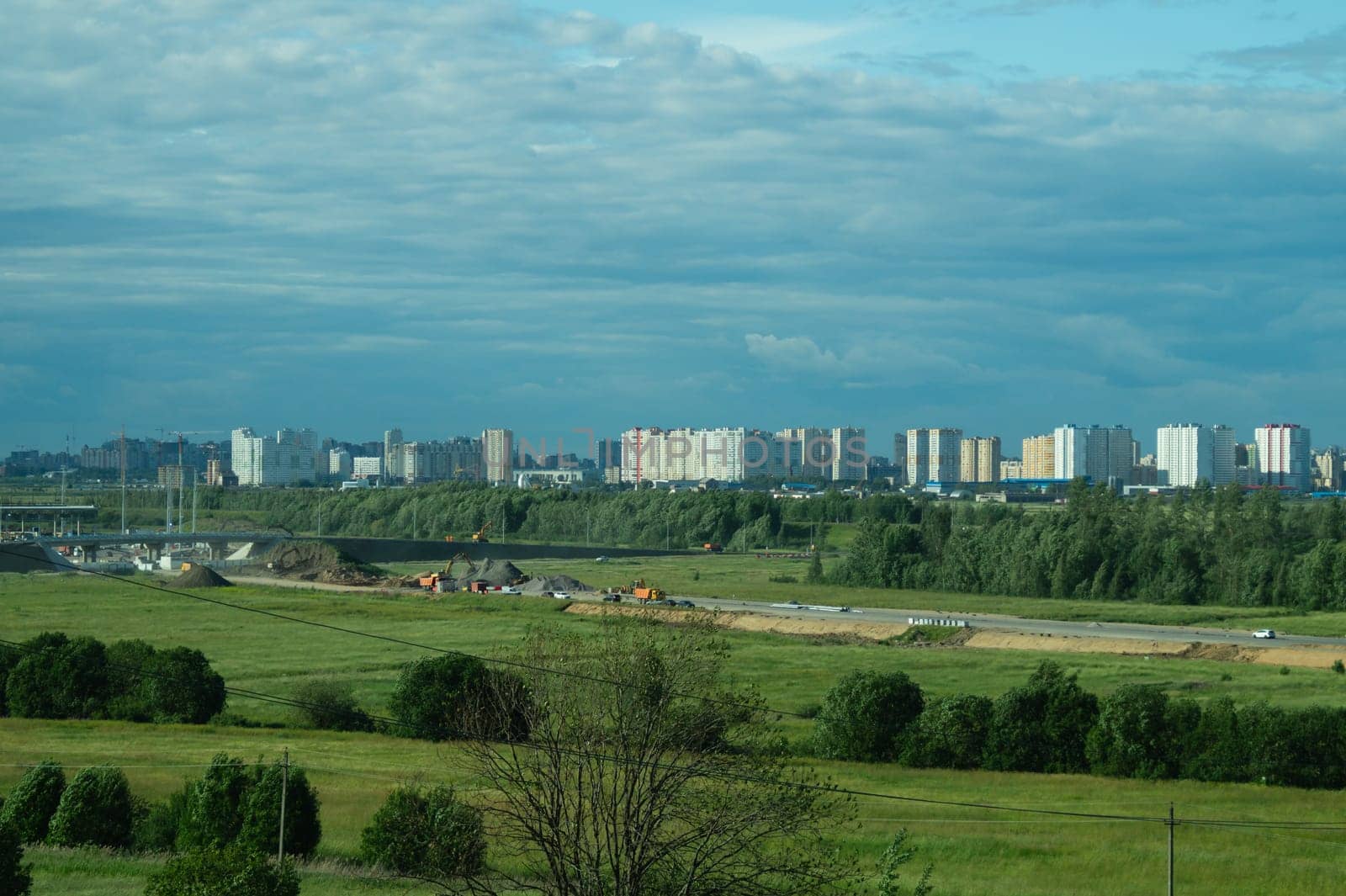 Urban cityscape panoramic view. horizon line with buildings. nature landscape with town and forest. blue sky. city into a distance