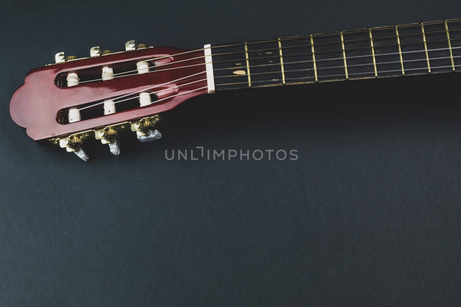 Guitar fretboard close up. musical instrument. strings on the guitar neck. copy space