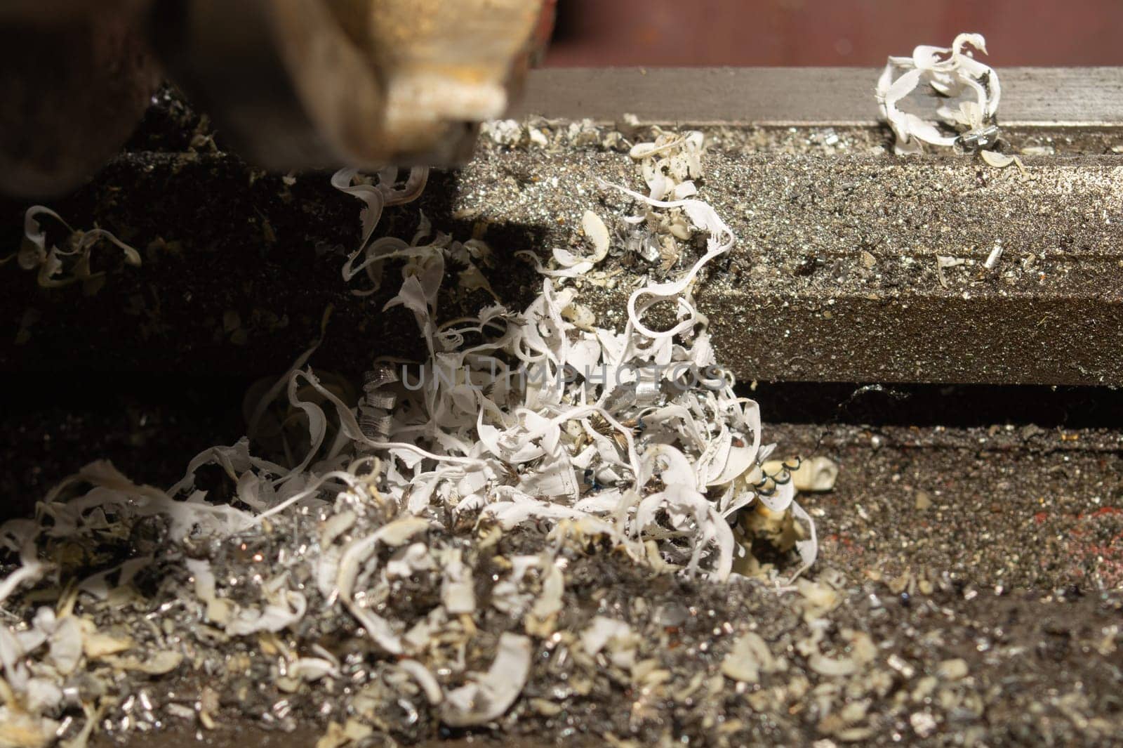 Twisted spiral steel shavings close up. drilling and lathe industry. metal engineering technology. metalworking process