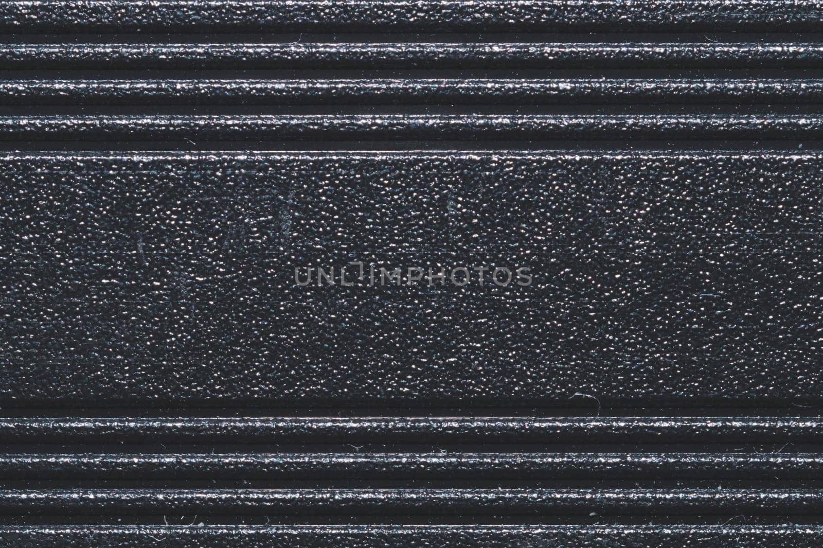 Black plastic texture. ribbed background
