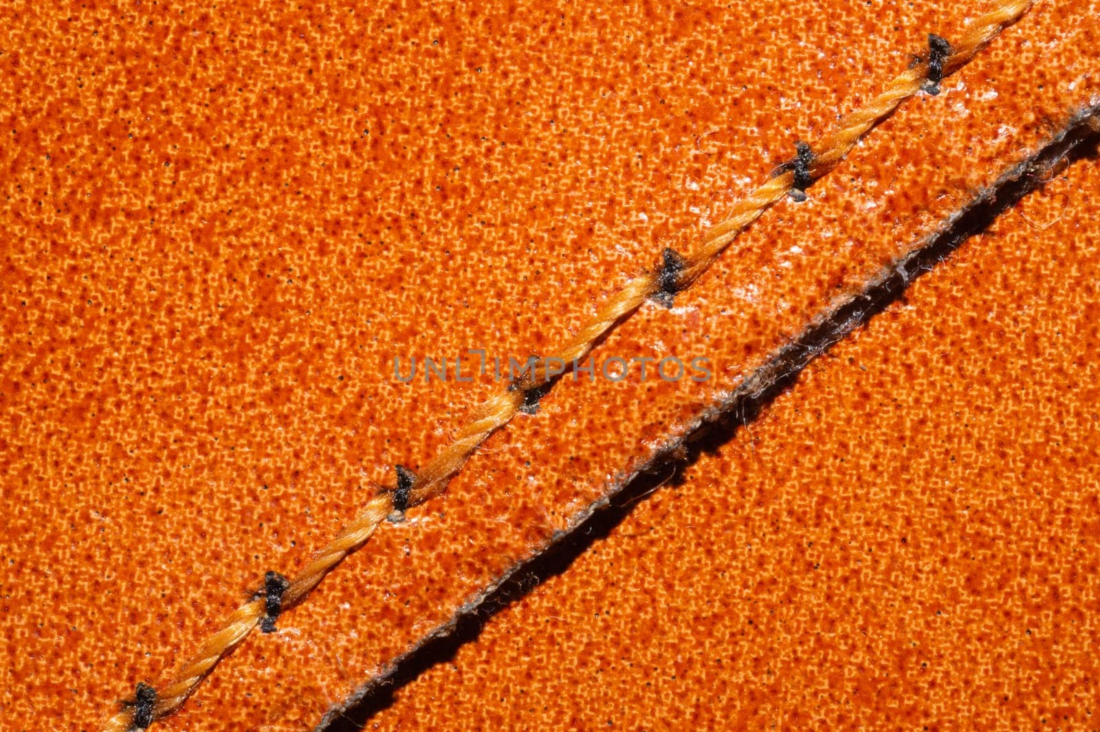 Brown leather texture with a linear stitch. material with seam