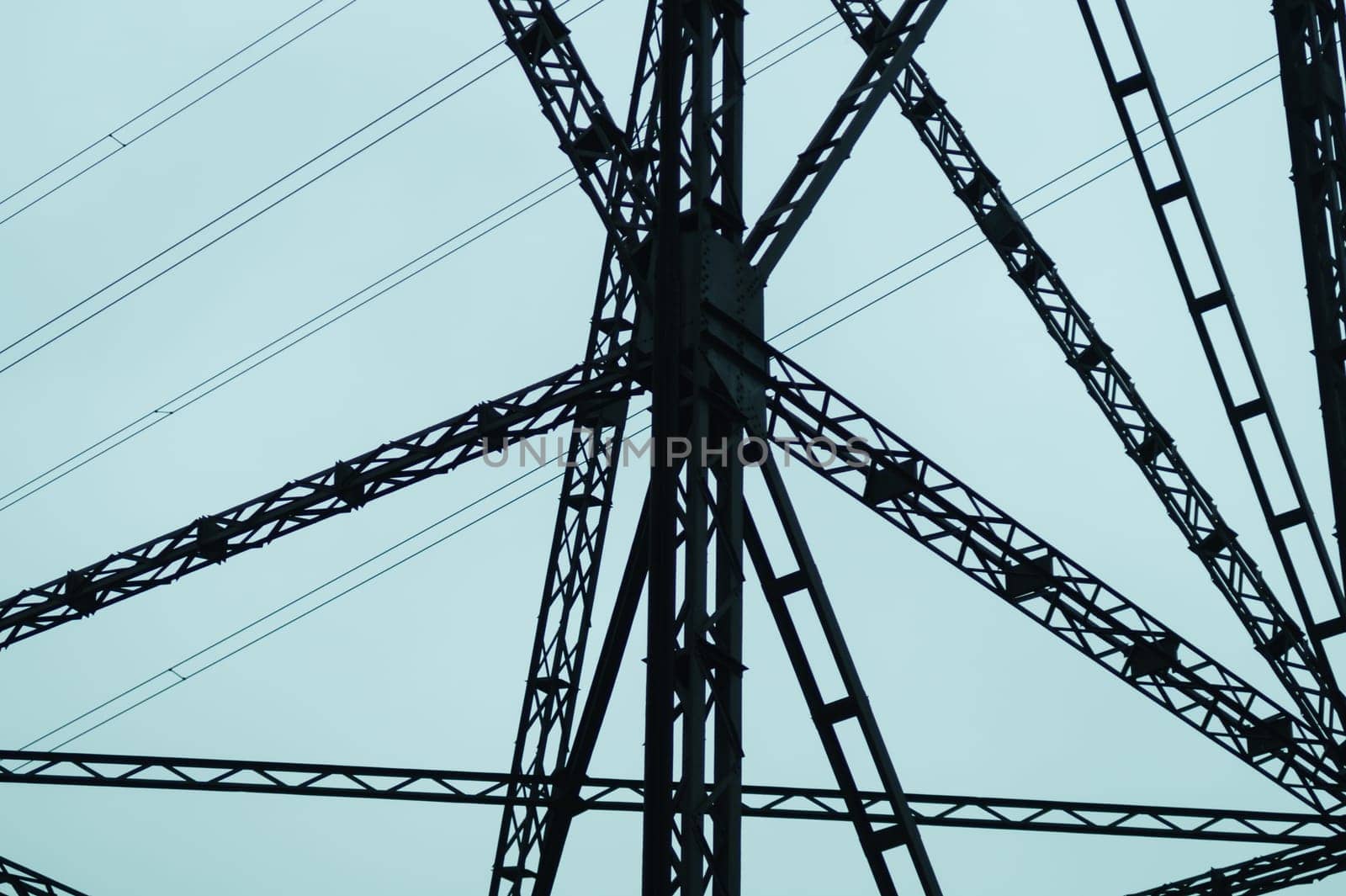 Detail of power line post. high voltage tower with the sky. industrial background