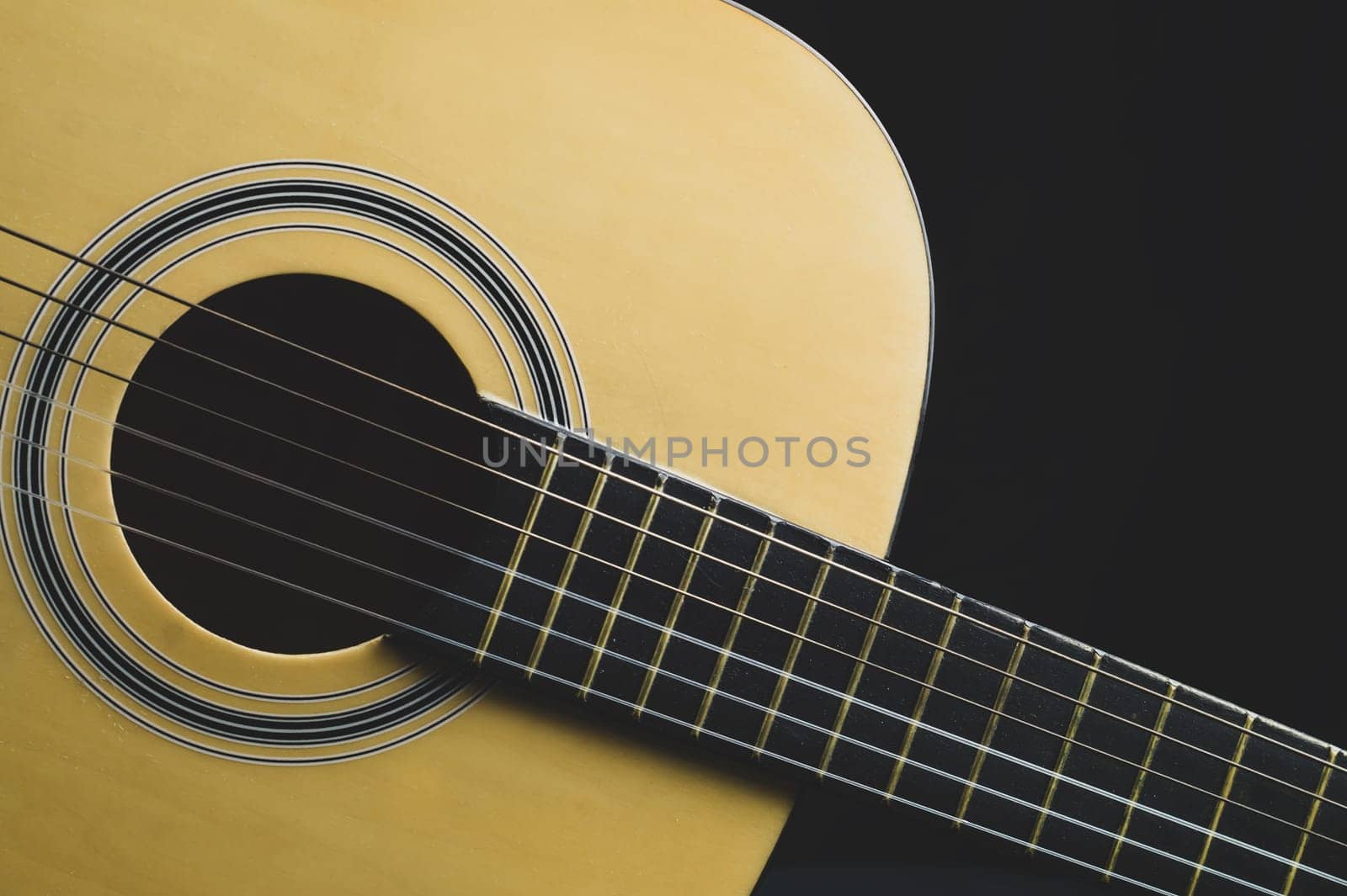 Acoustic guitar close up. musical instrument. strings on the guitar fretboard