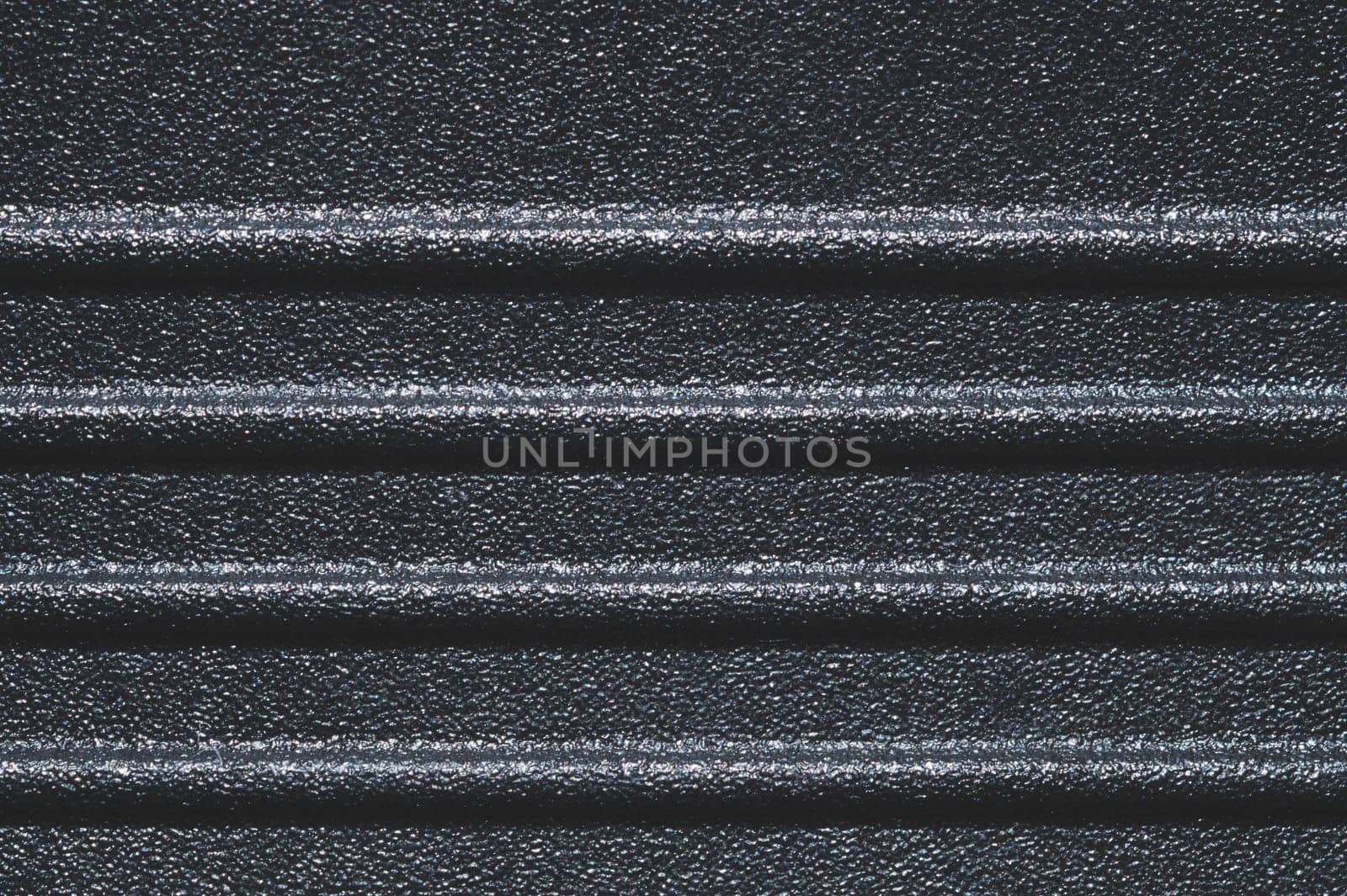 Black plastic texture. ribbed background