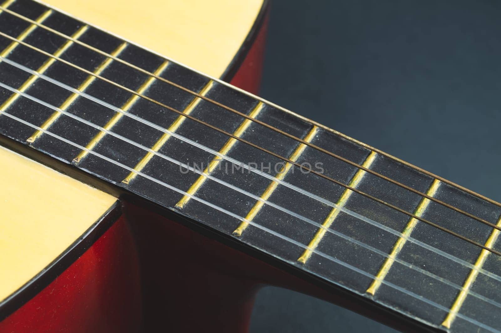 Acoustic guitar close up. musical instrument. strings on the guitar fretboard