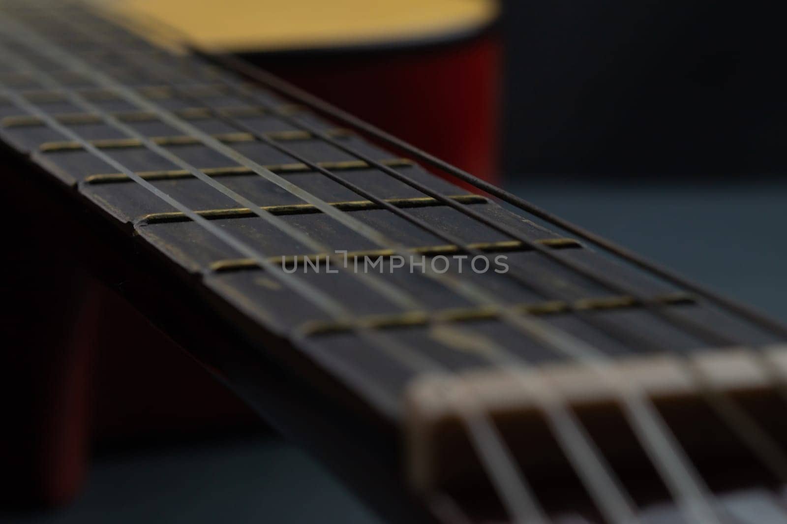 Acoustic guitar close up. musical instrument. strings on the guitar fretboard