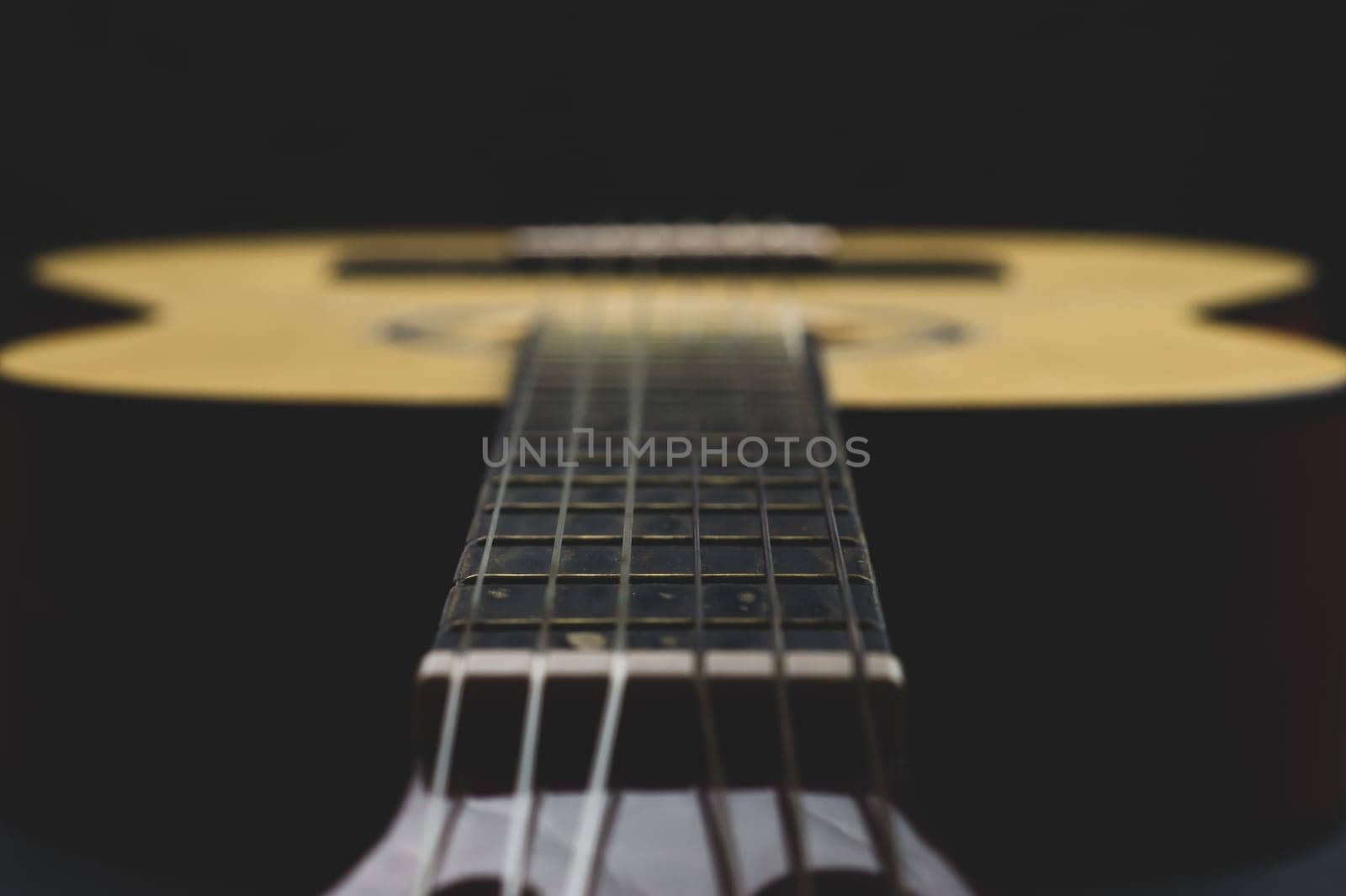 Acoustic guitar close up. musical instrument. strings on the guitar fretboard